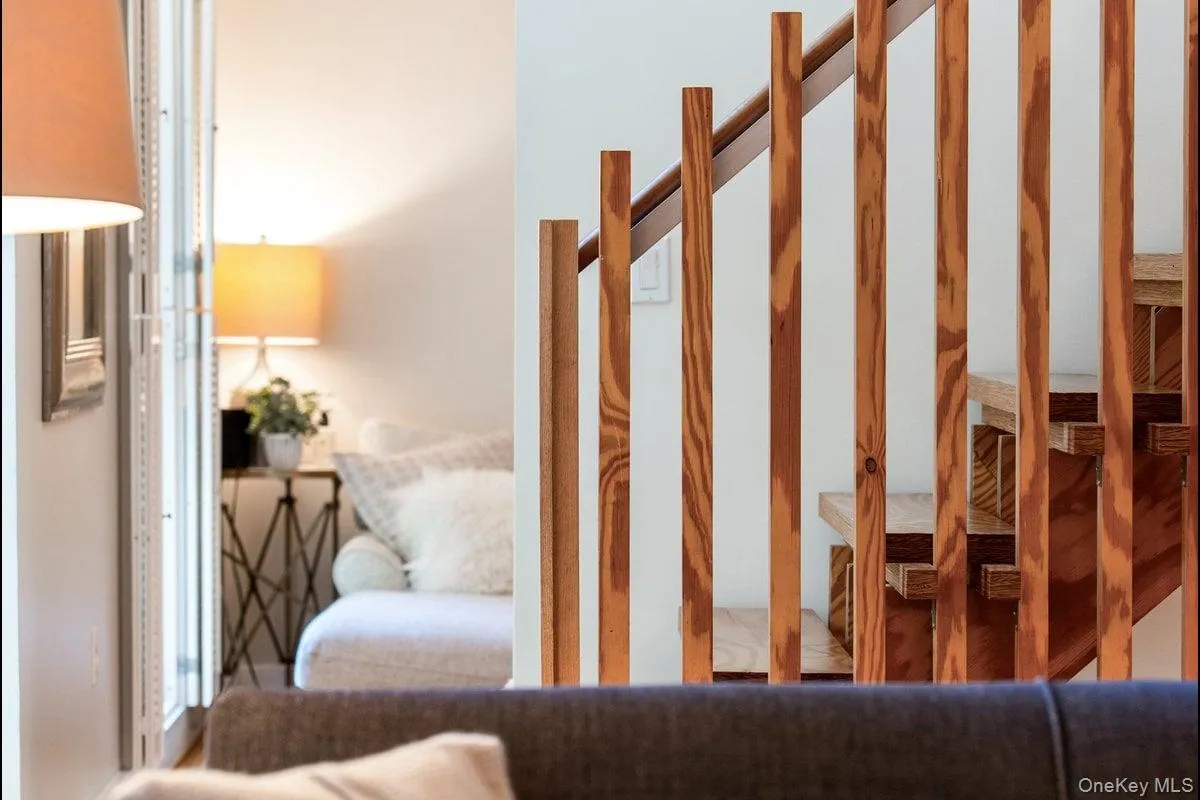 Pass through the living room into the den, or head upstairs to the second floor where the beautiful wooden staircase guides your way. Pass through the living room into the den, or head upstairs to the second floor where the beautiful wooden staircase guides your way.