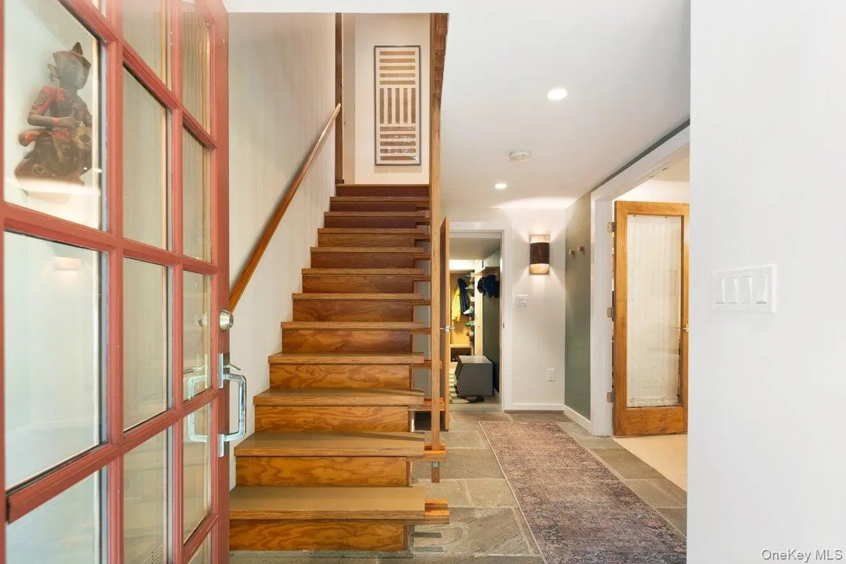 Head up to the main floor via the architecturally distinct wooden staircase. Head up to the main floor via the architecturally distinct wooden staircase.