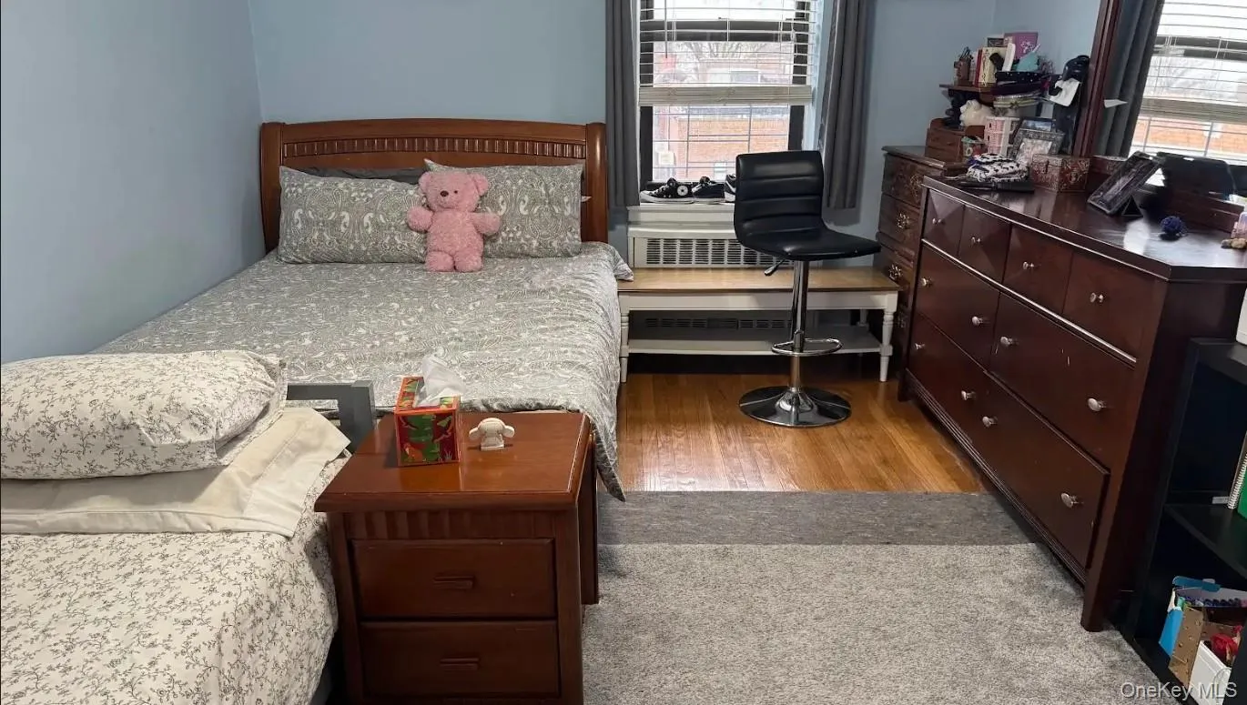 Bedroom featuring light wood finished floors Bedroom featuring light wood finished floors