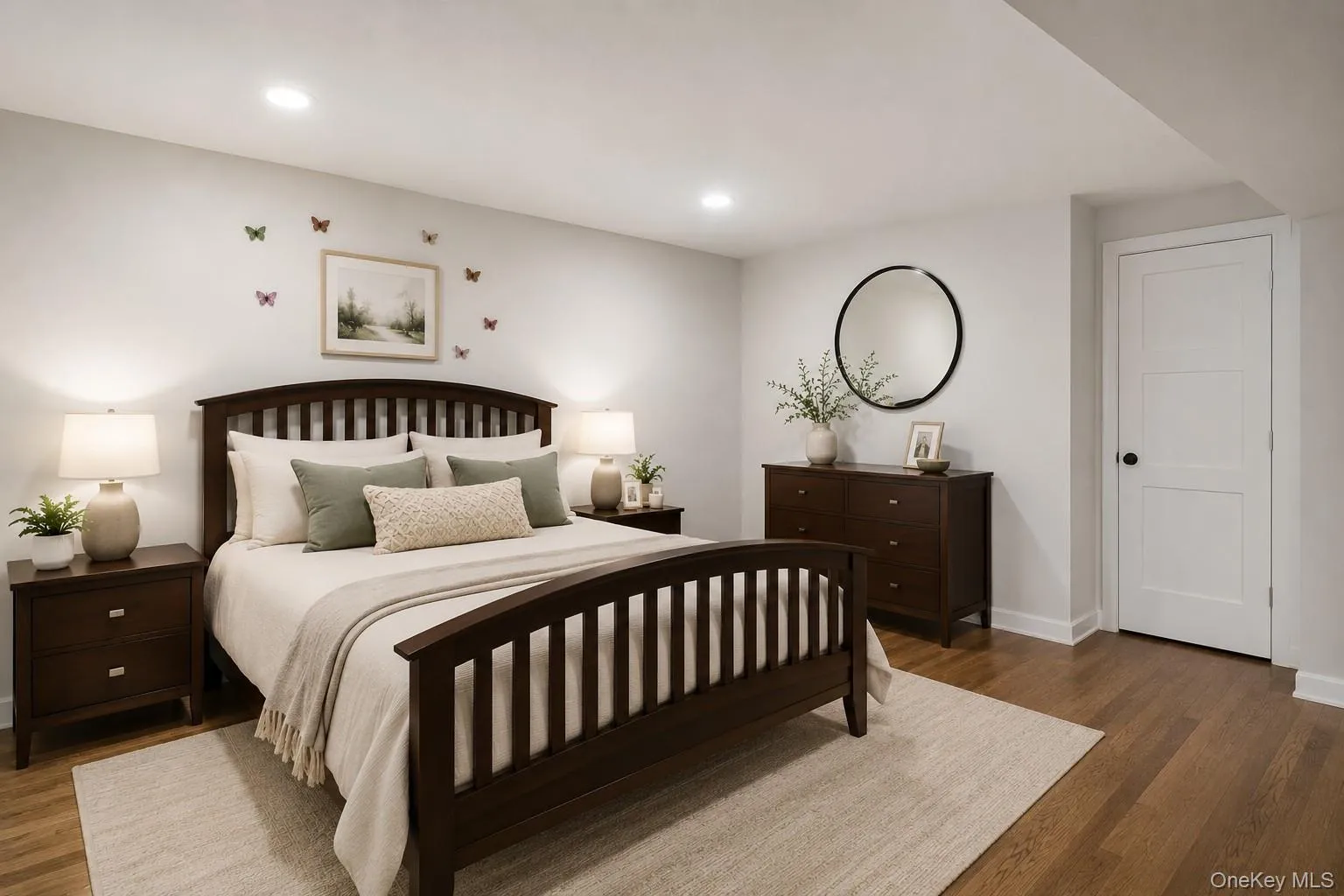 Recessed lighting, wood-finish flooring, white paneled door, and white trim Recessed lighting, wood-finish flooring, white paneled door, and white trim