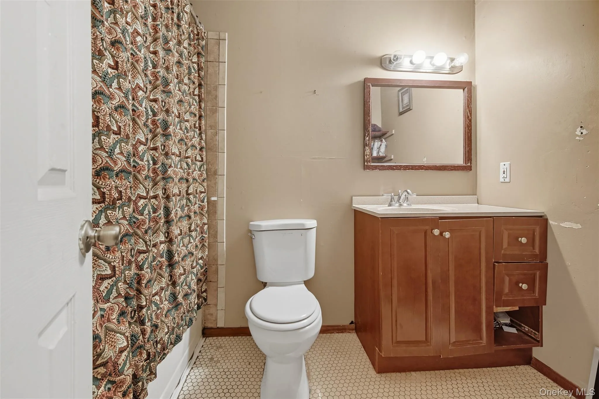 Bathroom featuring vanity and shower / bath combo Bathroom featuring vanity and shower / bath combo