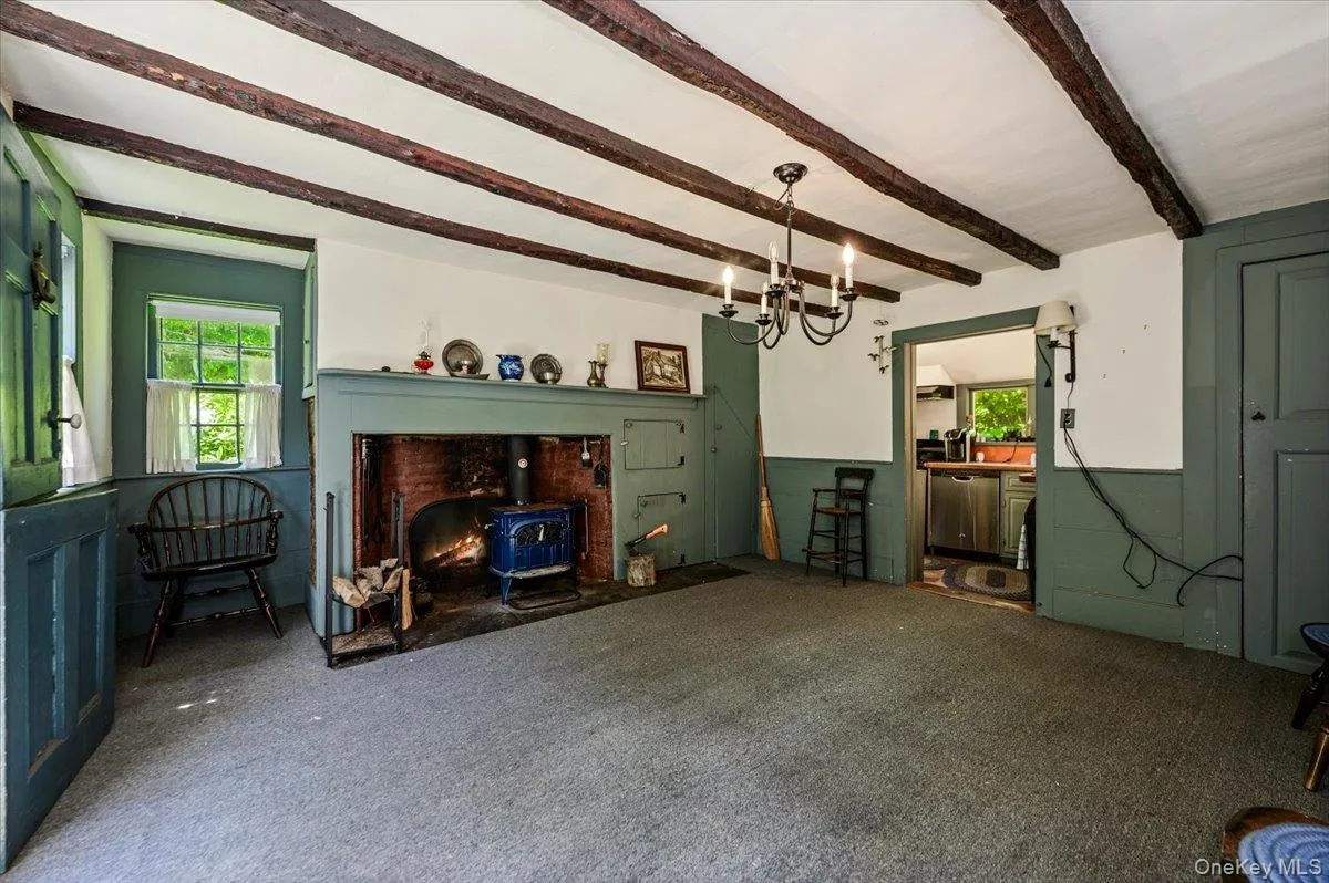 Large brick fireplace, ceiling beams, wood details Large brick fireplace, ceiling beams, wood details