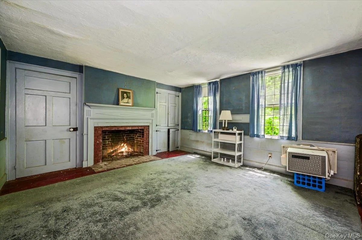 Orignal wide plank wood floors, large brick fireplace and built-ins. Orignal wide plank wood floors, large brick fireplace and built-ins.