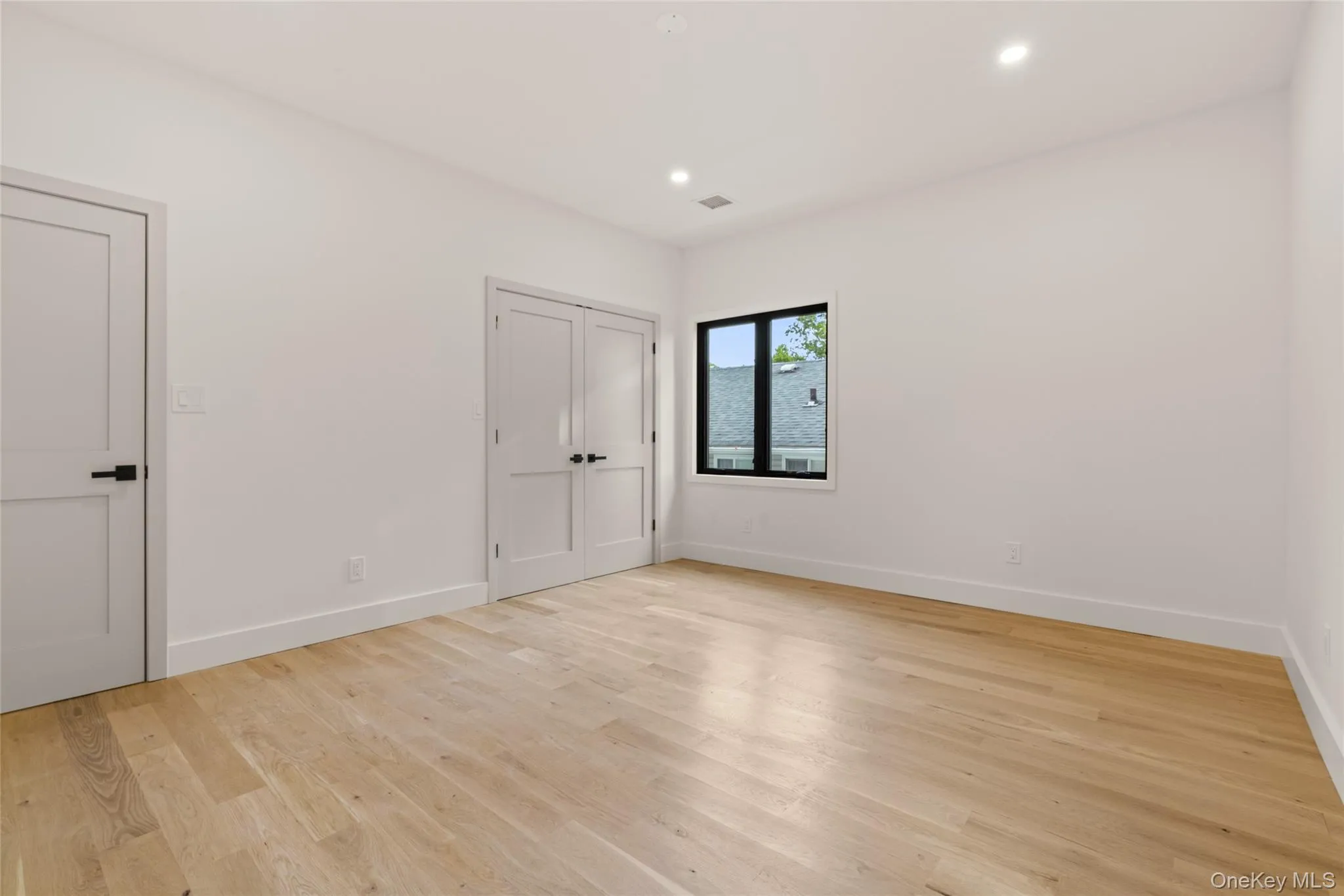 Light wood-finish flooring complements the neutral wall tones in this room Light wood-finish flooring complements the neutral wall tones in this room