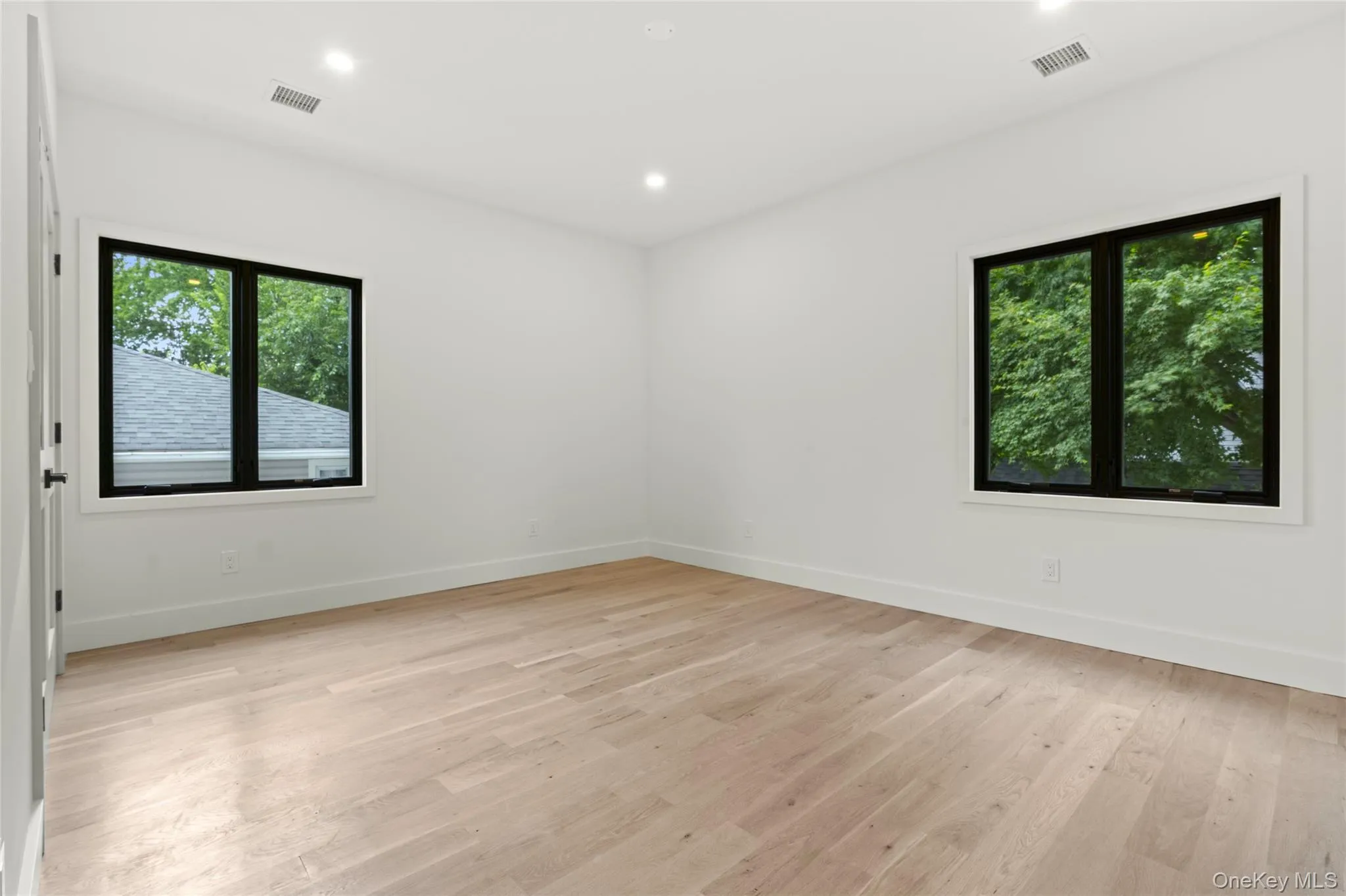 Bright interior space featuring light wood-finish flooring Bright interior space featuring light wood-finish flooring