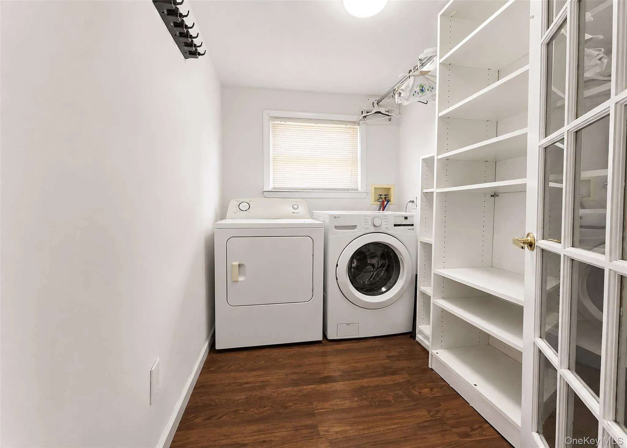 Updated Laundry Room W/Built-In Organizers, Laminate Wood Flooring, & Front Loading Washer/Dryer. Updated Laundry Room W/Built-In Organizers, Laminate Wood Flooring, & Front Loading Washer/Dryer.