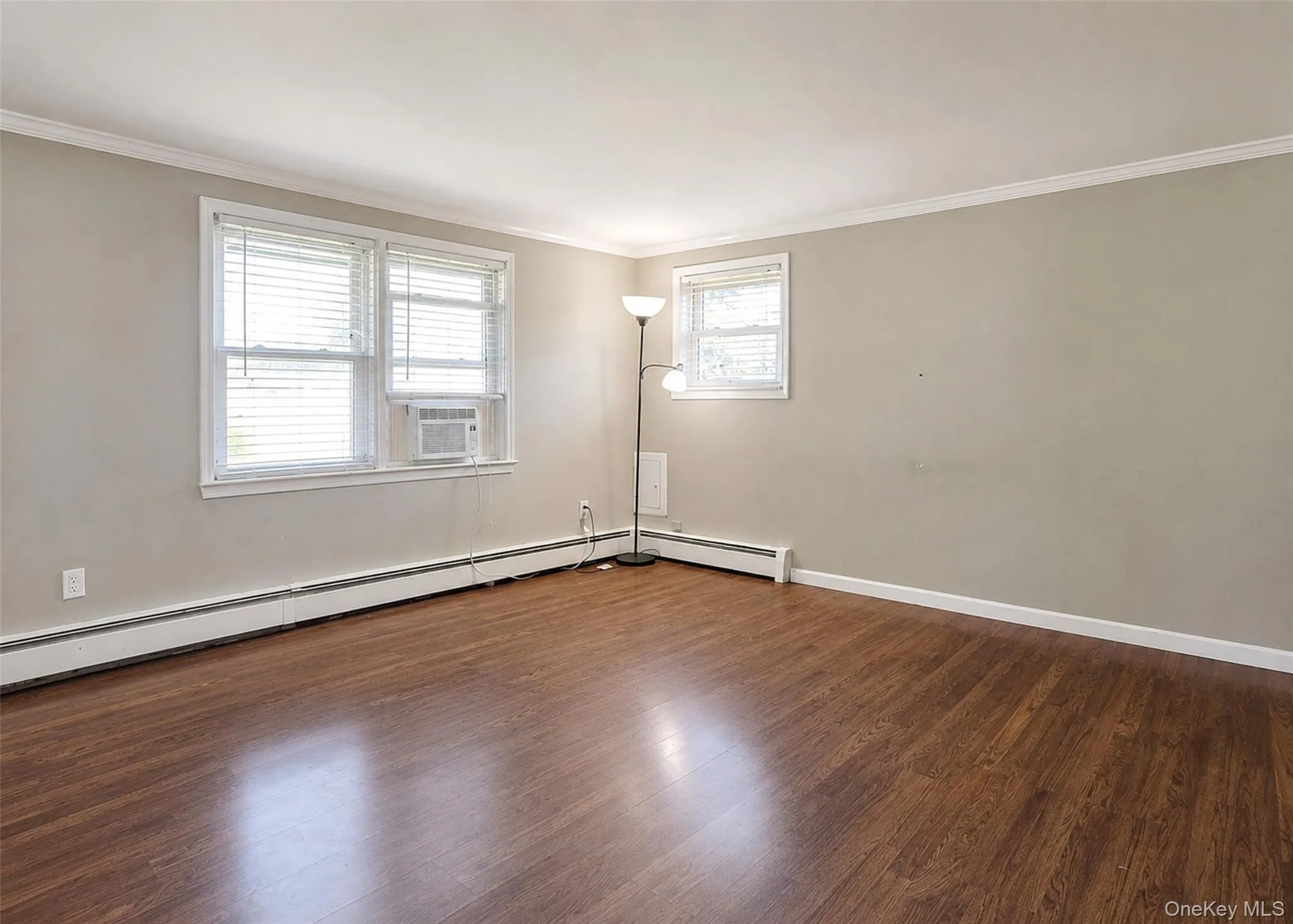 Spacious Living Room W/Laminate Wood Flooring. Spacious Living Room W/Laminate Wood Flooring.