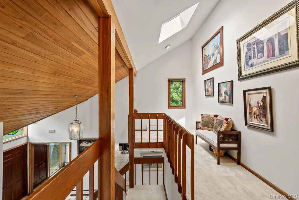 2nd floor Loft area overlooking Entry Foyer and Living Room. Cathedral Ceiling and Skylight. 2nd floor Loft area overlooking Entry Foyer and Living Room. Cathedral Ceiling and Skylight.