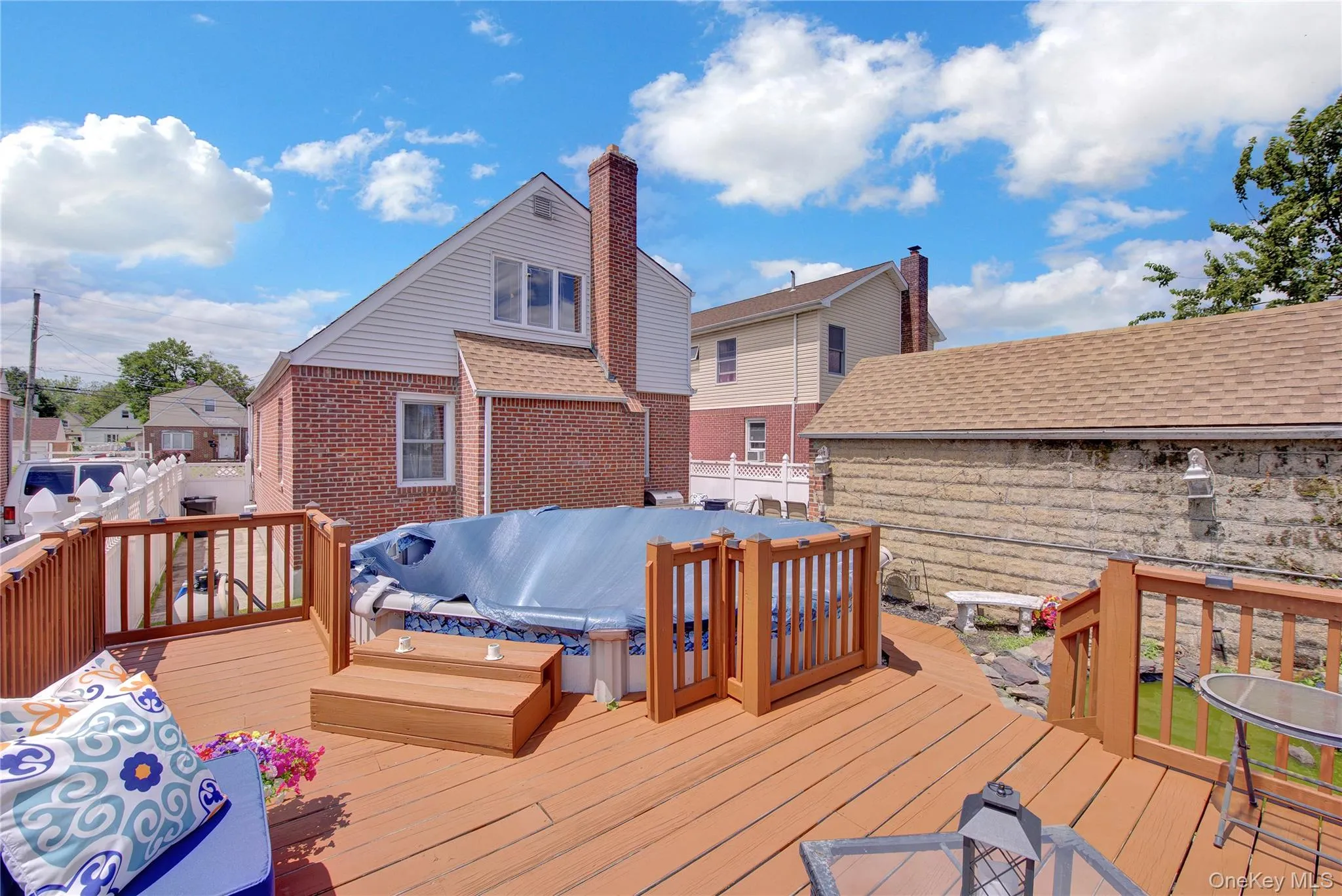 Expansive wood deck with a built-in above-ground pool Expansive wood deck with a built-in above-ground pool