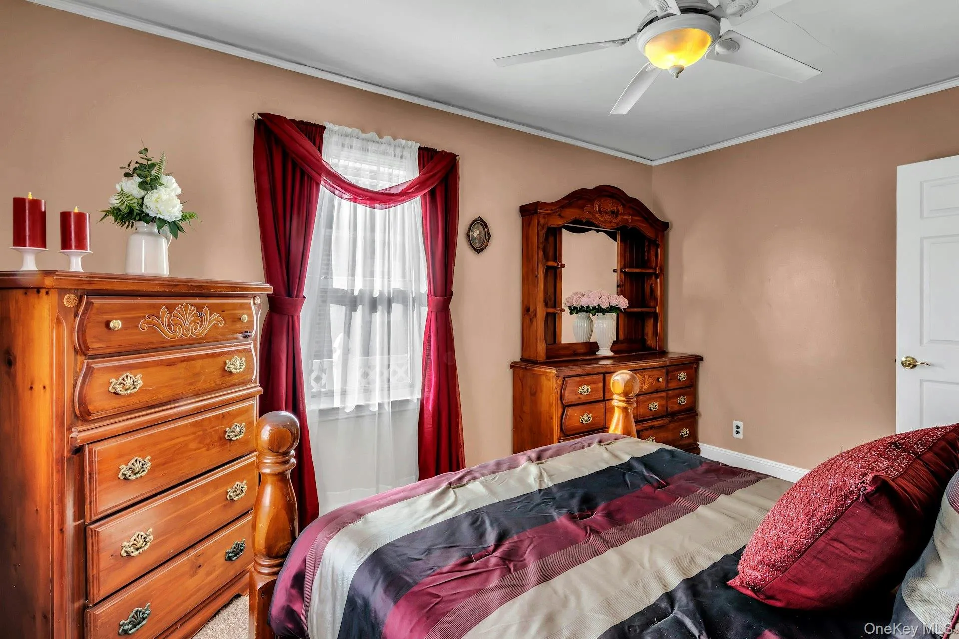 Neutral-toned walls complement the white trim and ceiling fan with integrated lighting Neutral-toned walls complement the white trim and ceiling fan with integrated lighting