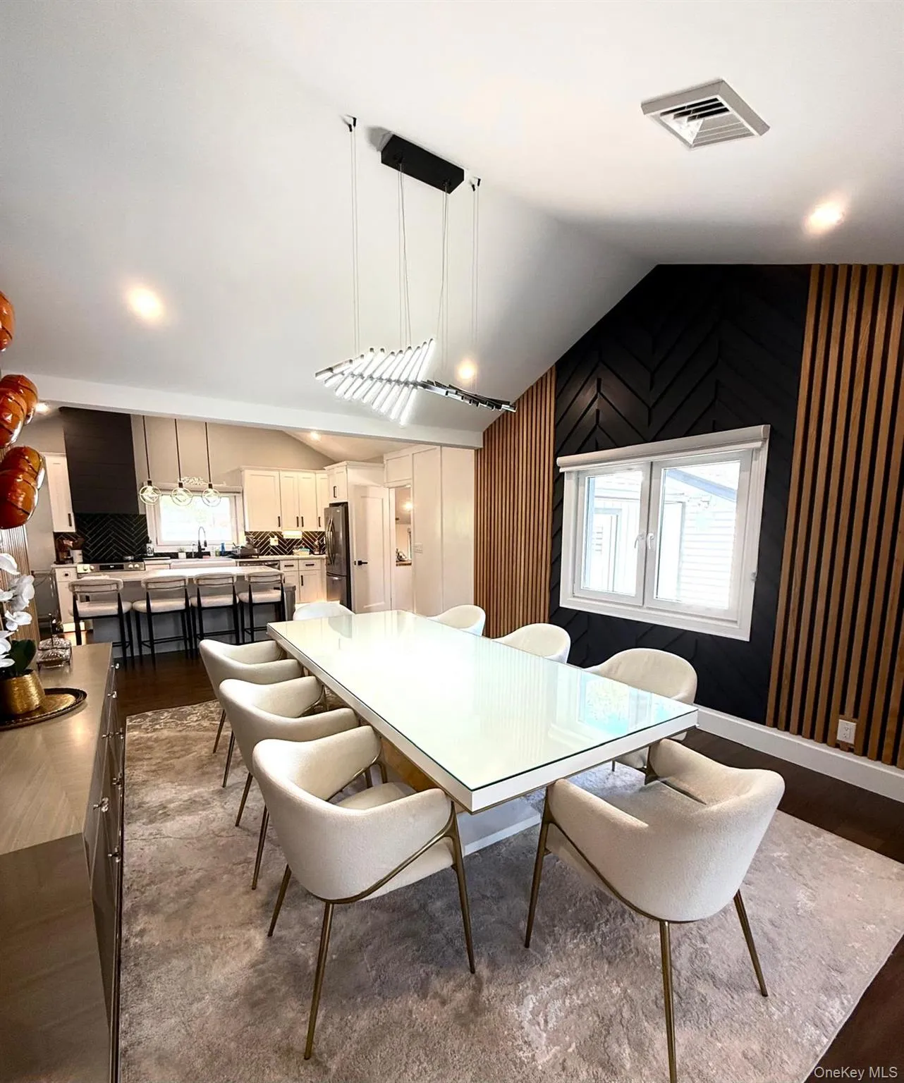 Open-concept living space with vaulted ceilings Open-concept living space with vaulted ceilings