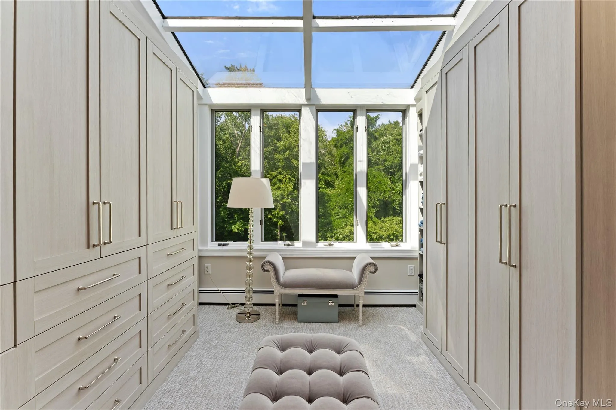 Walk-in closet with custom built-in cabinetry Walk-in closet with custom built-in cabinetry