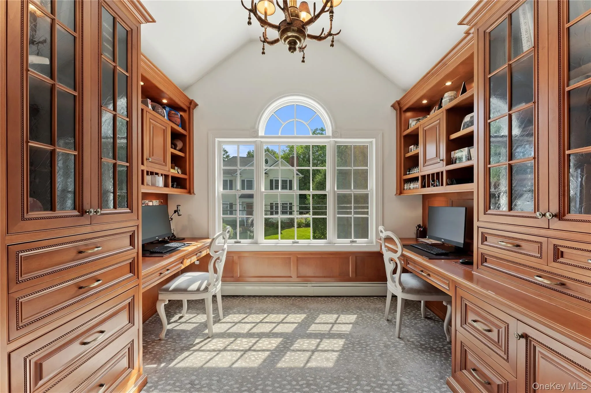 Office with custom built in cabinetry with two desks ideal for working from home Office with custom built in cabinetry with two desks ideal for working from home