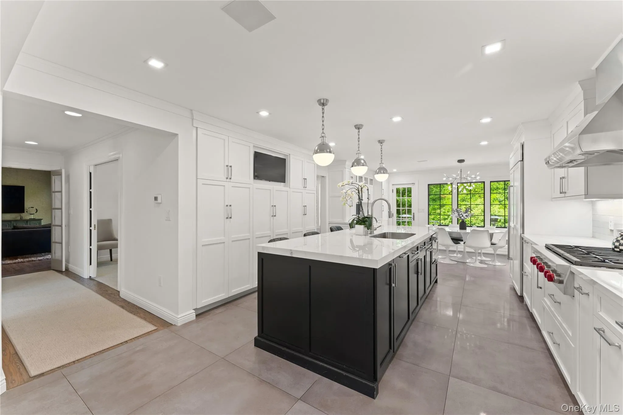 Kitchen view with hallway leading to the dining room, living room and family rooms Kitchen view with hallway leading to the dining room, living room and family rooms