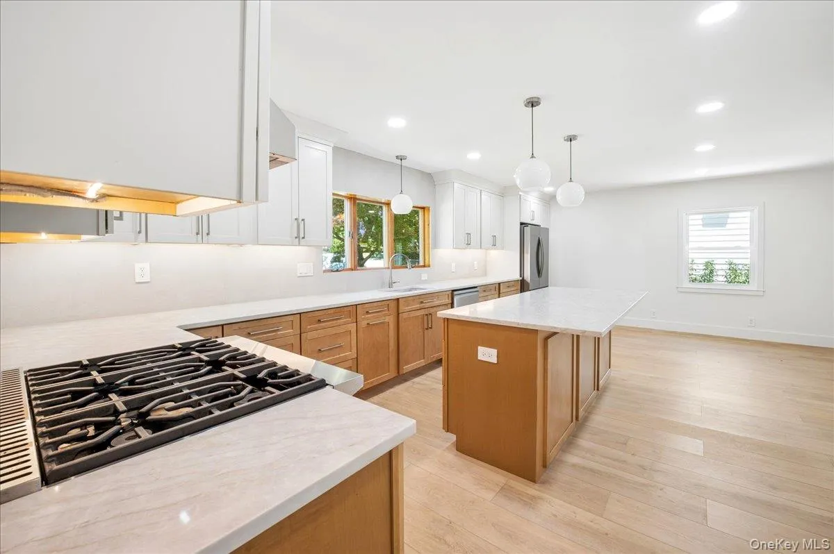 Brand new chef's kitchen with an island and breakfast table area. Brand new chef's kitchen with an island and breakfast table area.