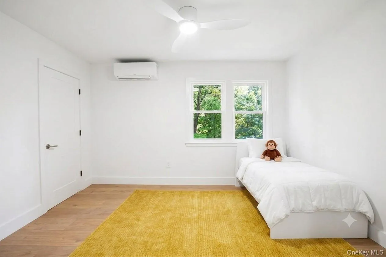 VIRTUALLY STAGED. This center bedroom accommodates a twin bed or could be an upstairs office. VIRTUALLY STAGED. This center bedroom accommodates a twin bed or could be an upstairs office.