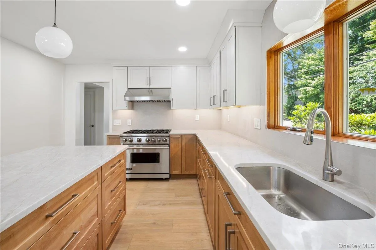 The Viking stove is a nice touch! The island has tons of storage and a built-in microwave. The Viking stove is a nice touch! The island has tons of storage and a built-in microwave.