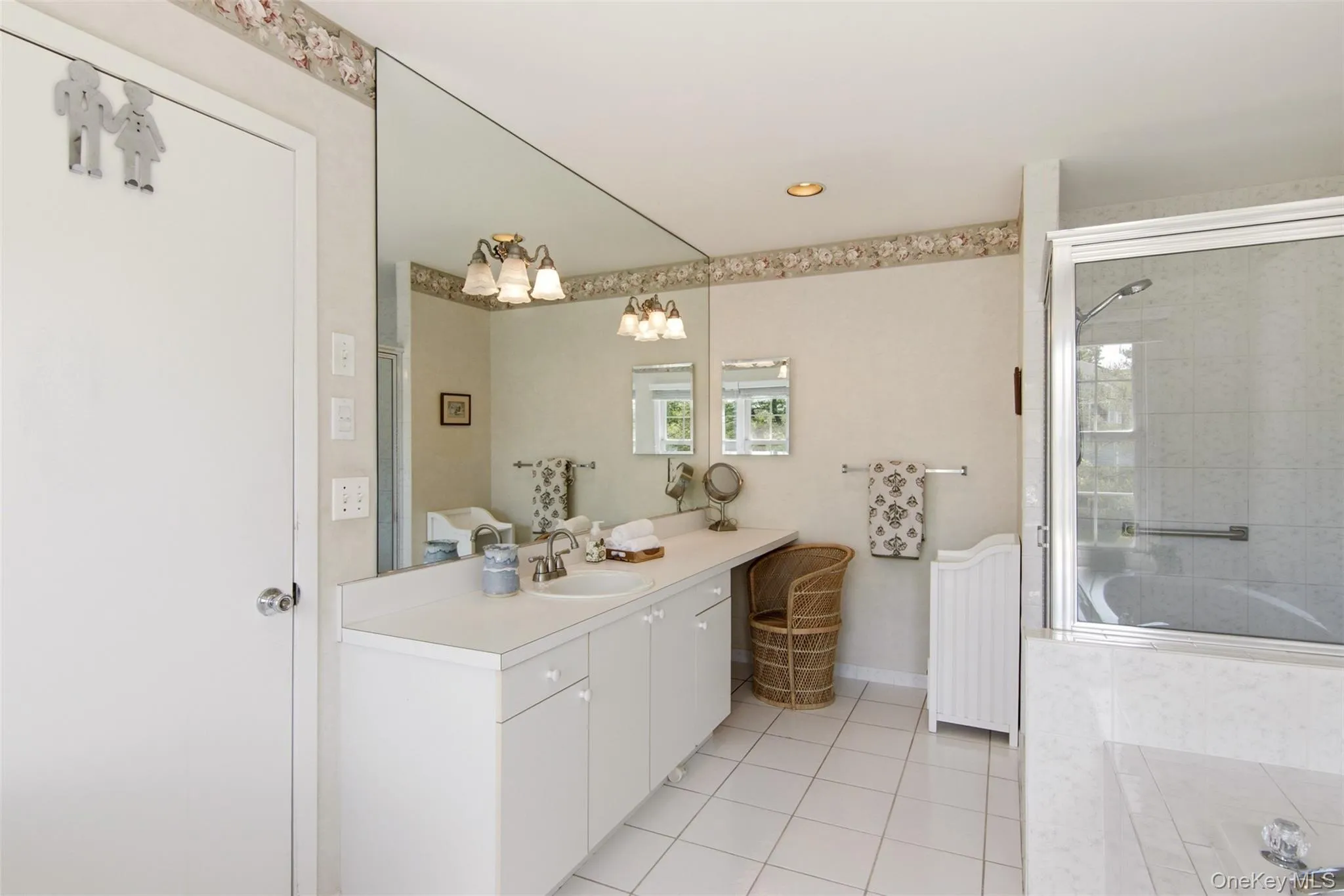 large vanity and shower in primary bath large vanity and shower in primary bath