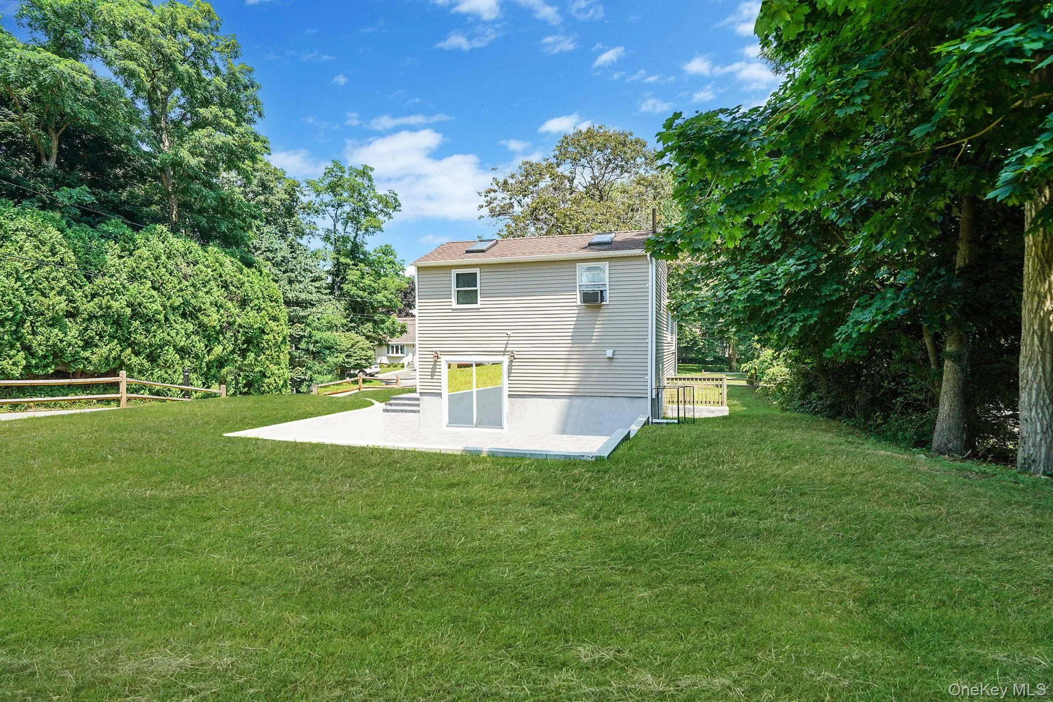 Rear view of property with a patio Rear view of property with a patio