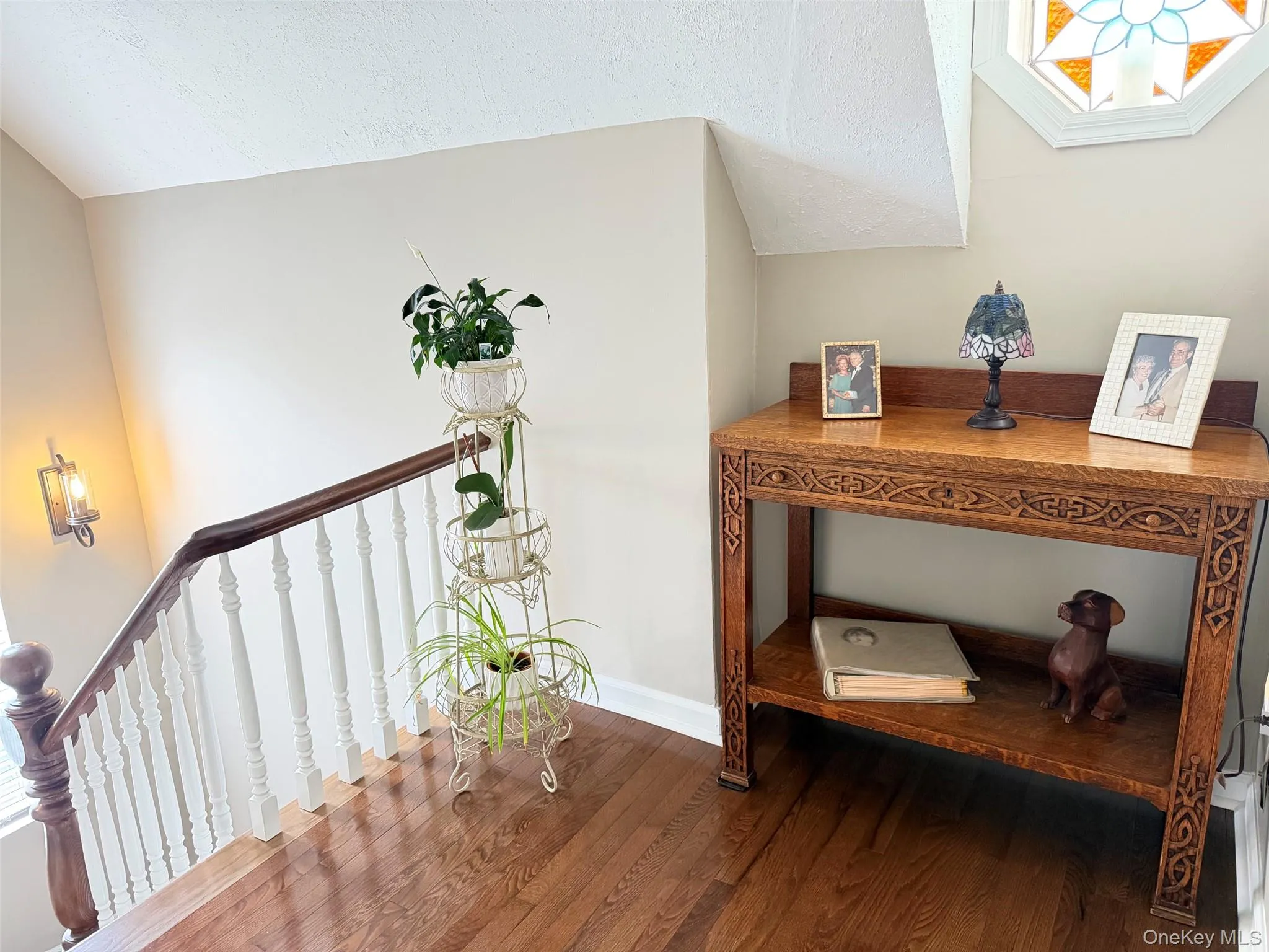 Landing at the top of stairs at the entry of the hallway Landing at the top of stairs at the entry of the hallway