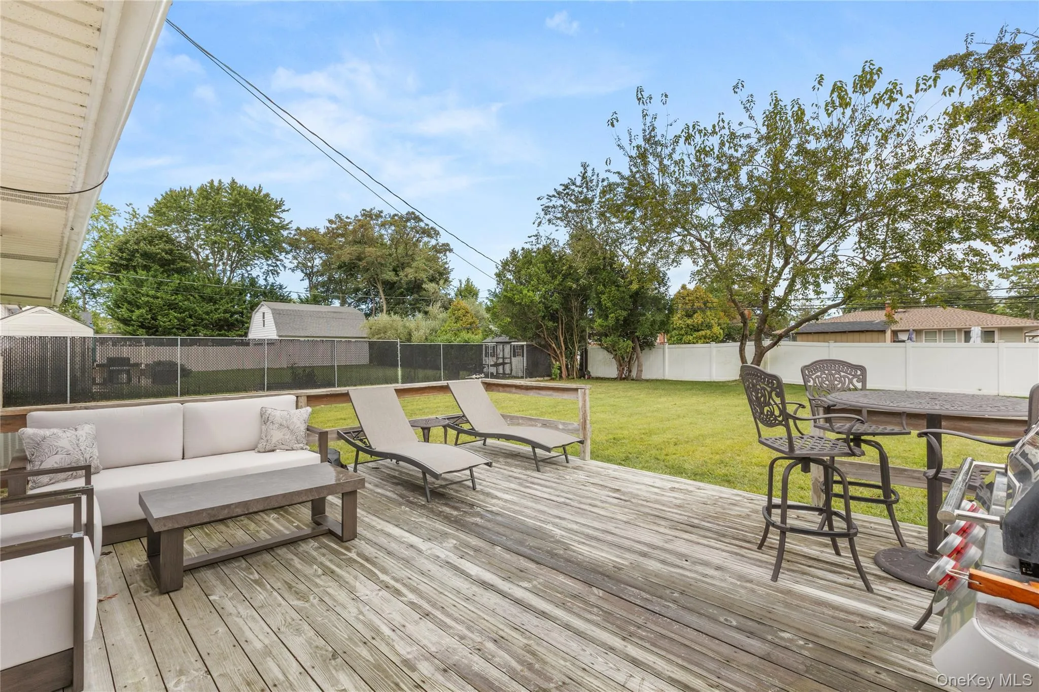 Deck featuring a fenced backyard and an outdoor hangout area Deck featuring a fenced backyard and an outdoor hangout area