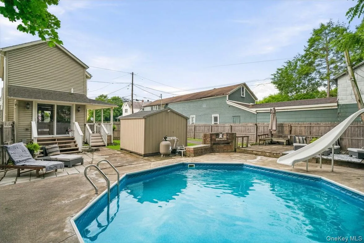 View of pool and back of home View of pool and back of home