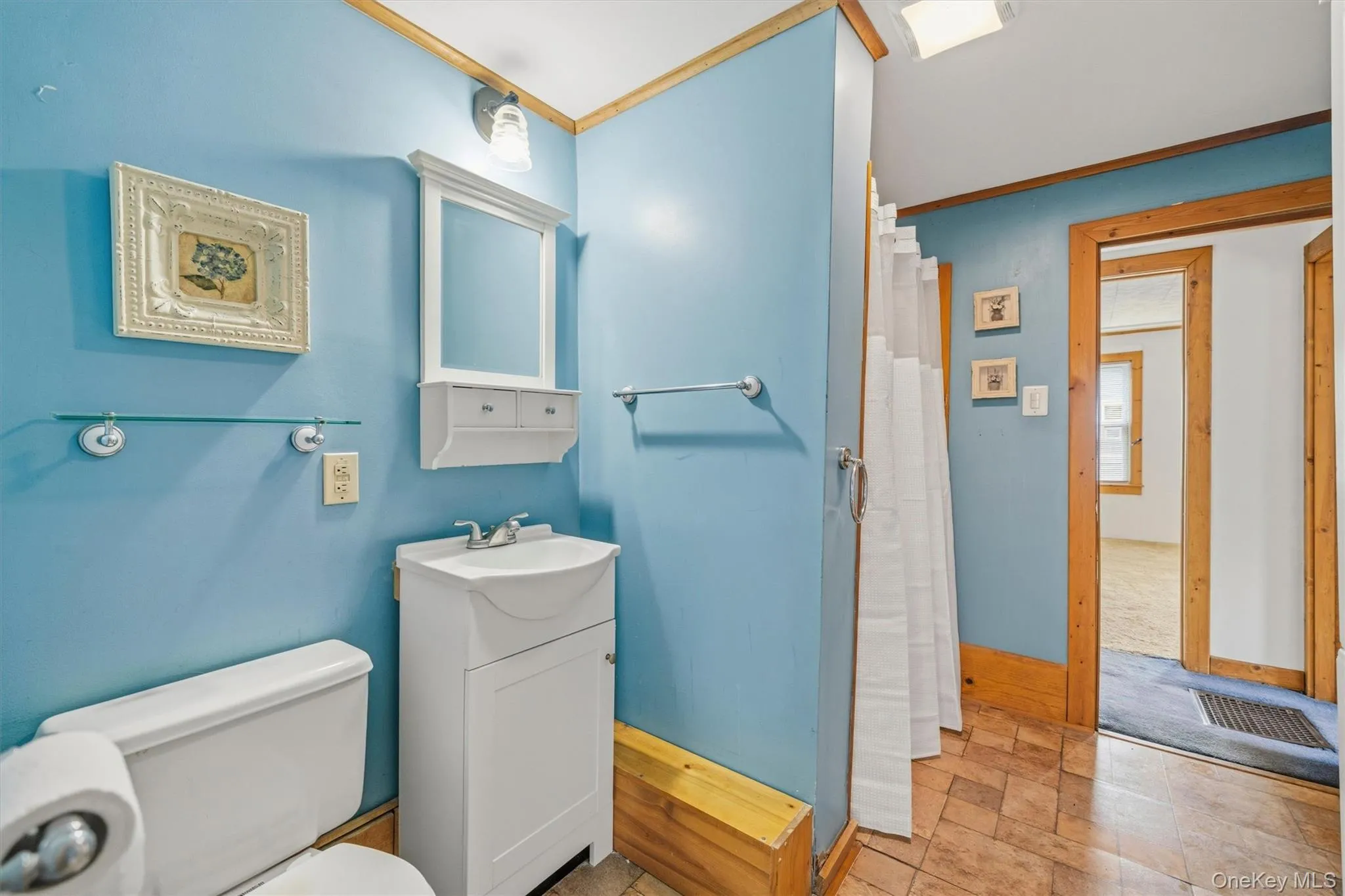 Bathroom with shower stall Bathroom with shower stall