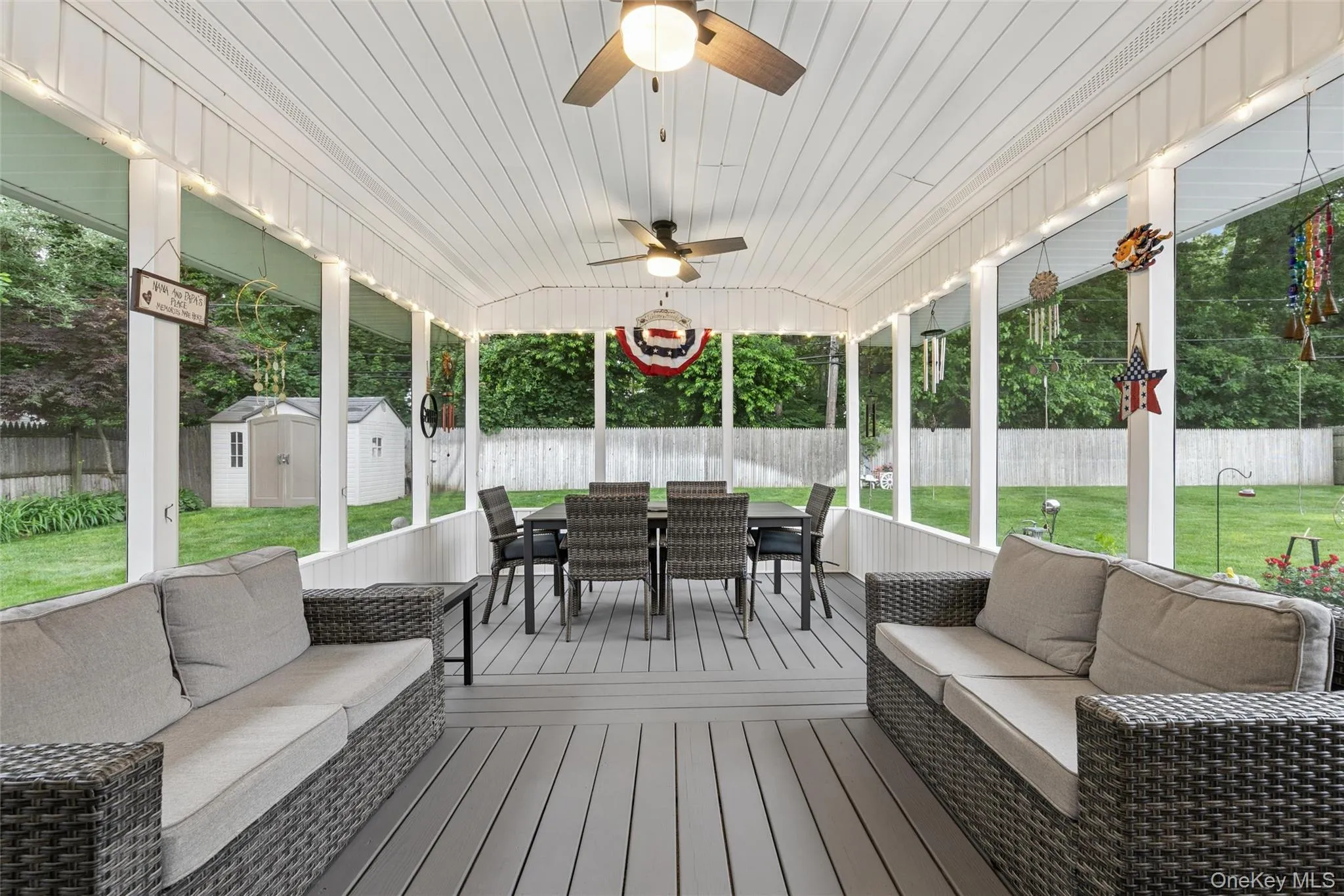 Expansive screened porch with two ceiling fans, a plank-style floor, Expansive screened porch with two ceiling fans, a plank-style floor,