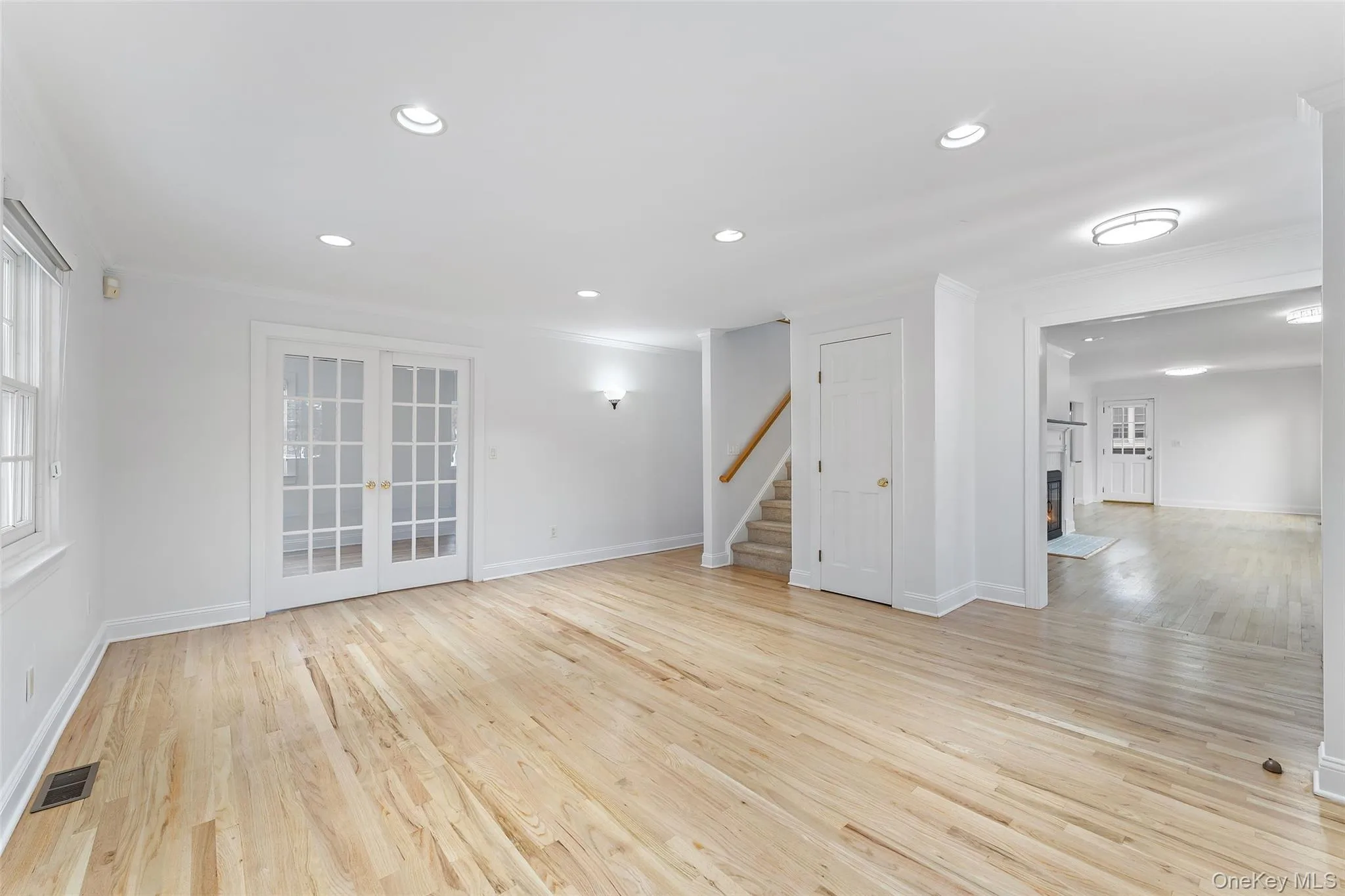 Living room with French doors that can open fully or remain closed for privacy Living room with French doors that can open fully or remain closed for privacy