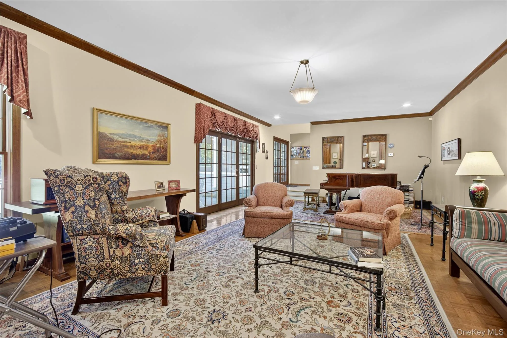 Living room with ornamental molding and recessed lighting Living room with ornamental molding and recessed lighting