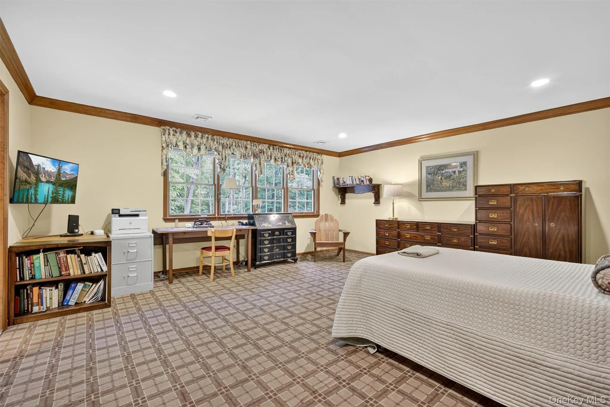 Carpeted bedroom featuring ornamental molding, recessed lighting, and a desk Carpeted bedroom featuring ornamental molding, recessed lighting, and a desk