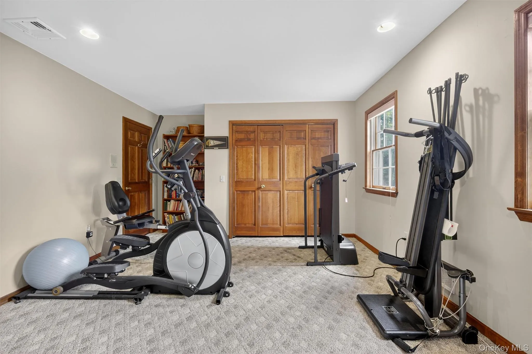 Workout area featuring light colored carpet and recessed lighting Workout area featuring light colored carpet and recessed lighting