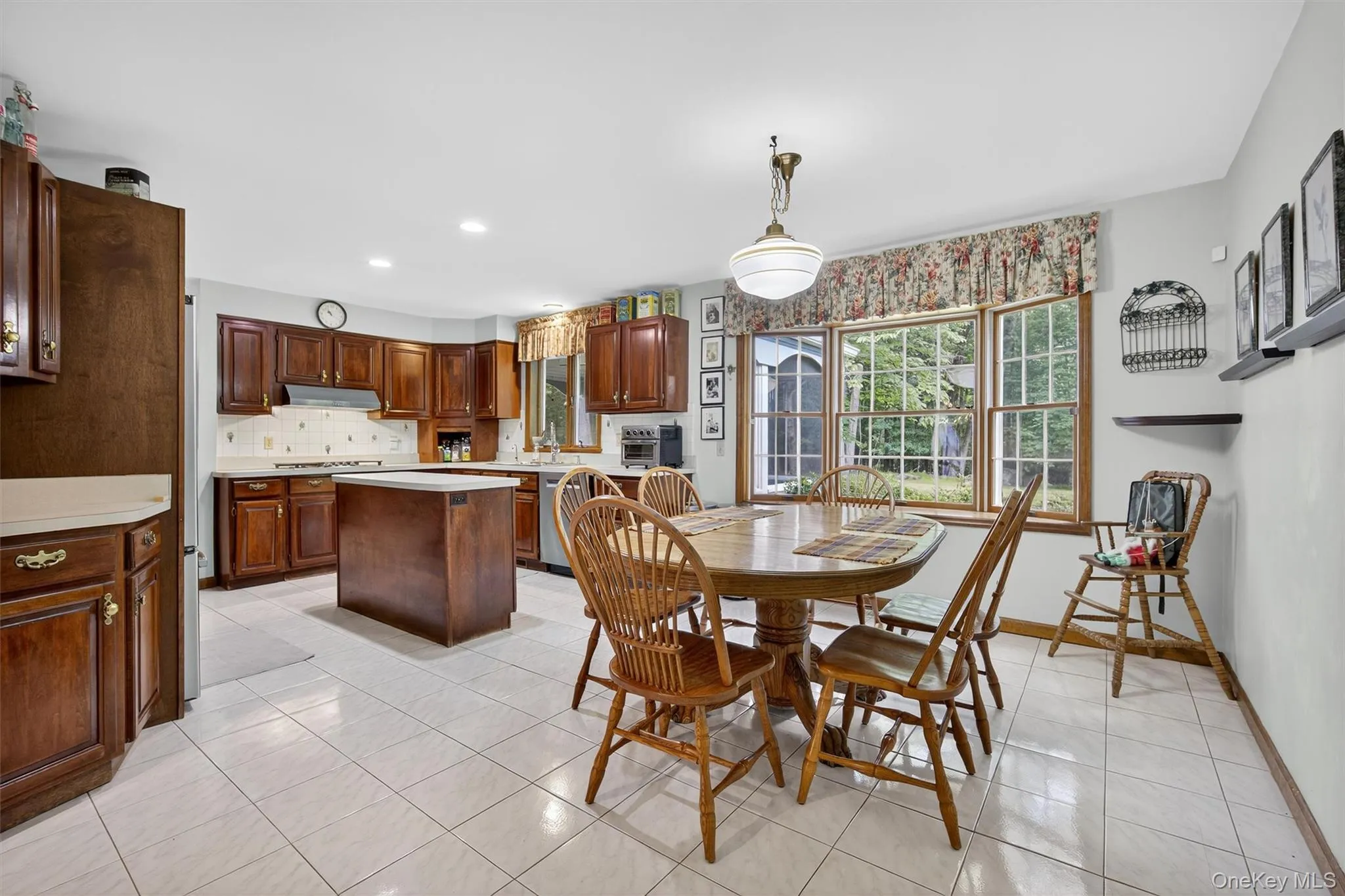 Dining area featuring light tile patterned floors and recessed lighting Dining area featuring light tile patterned floors and recessed lighting