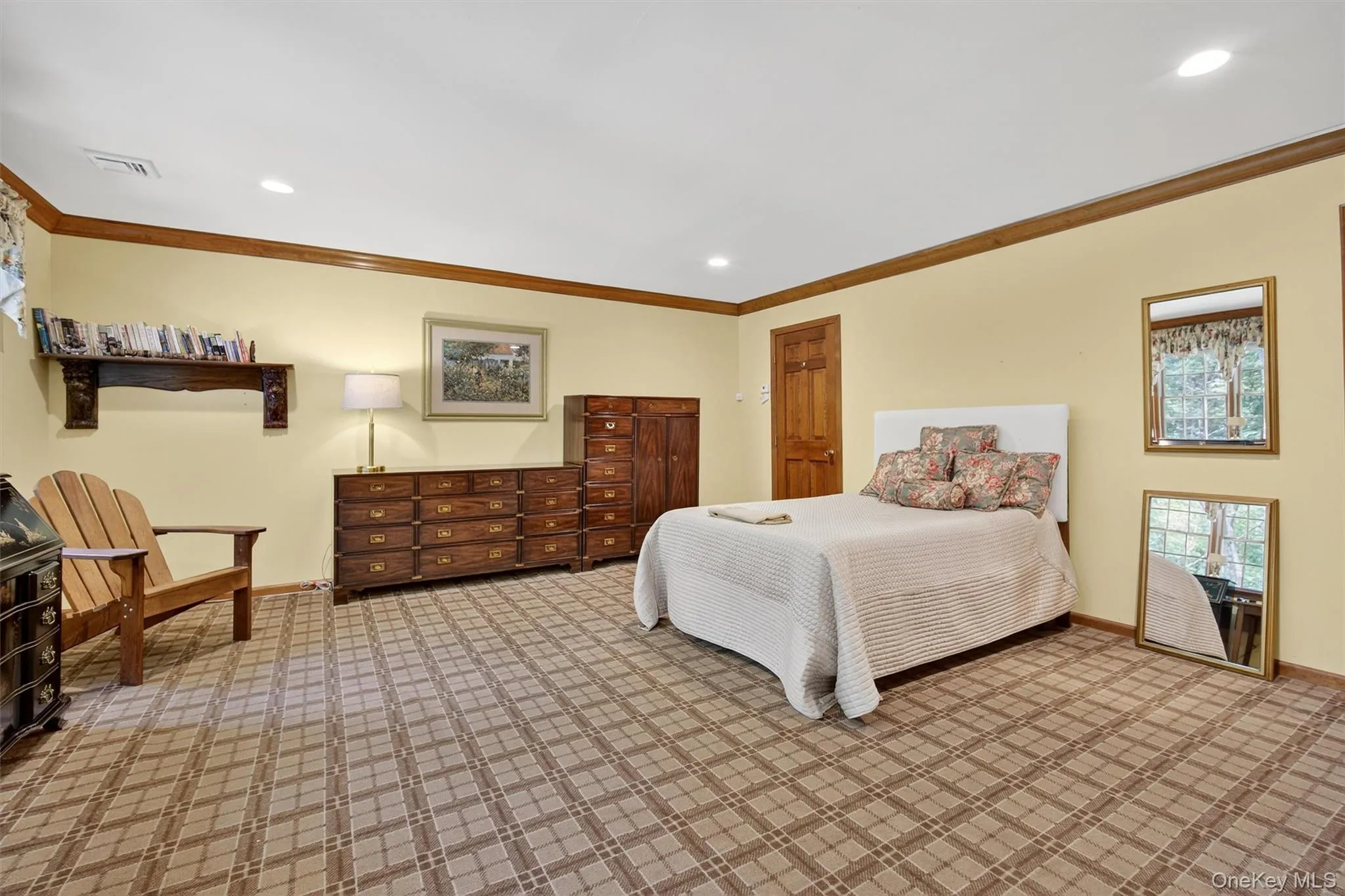 Bedroom with carpet floors, ornamental molding, and recessed lighting Bedroom with carpet floors, ornamental molding, and recessed lighting