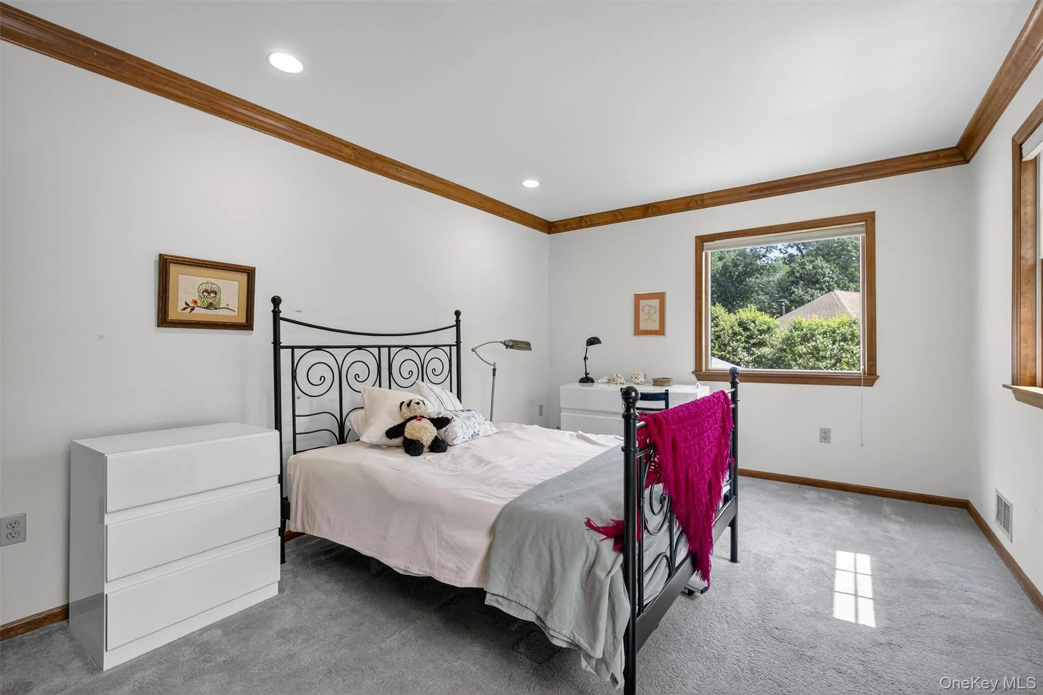 Bedroom with carpet floors, crown molding, and recessed lighting Bedroom with carpet floors, crown molding, and recessed lighting