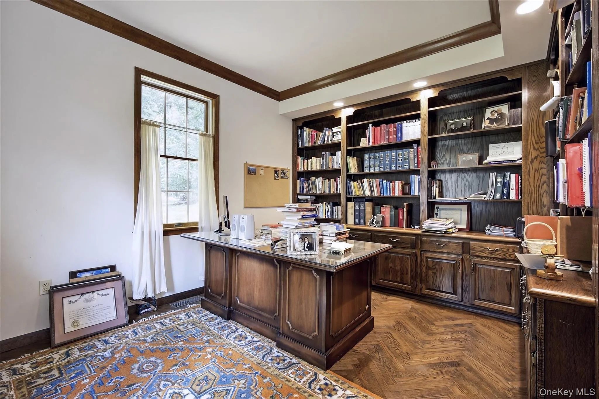 Office space featuring ornamental molding and baseboards Office space featuring ornamental molding and baseboards