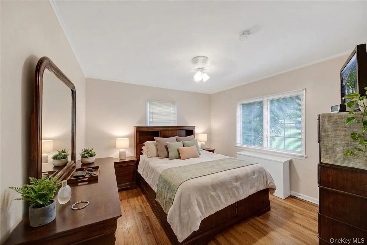First floor bedroom with hardwood flooring throughout First floor bedroom with hardwood flooring throughout