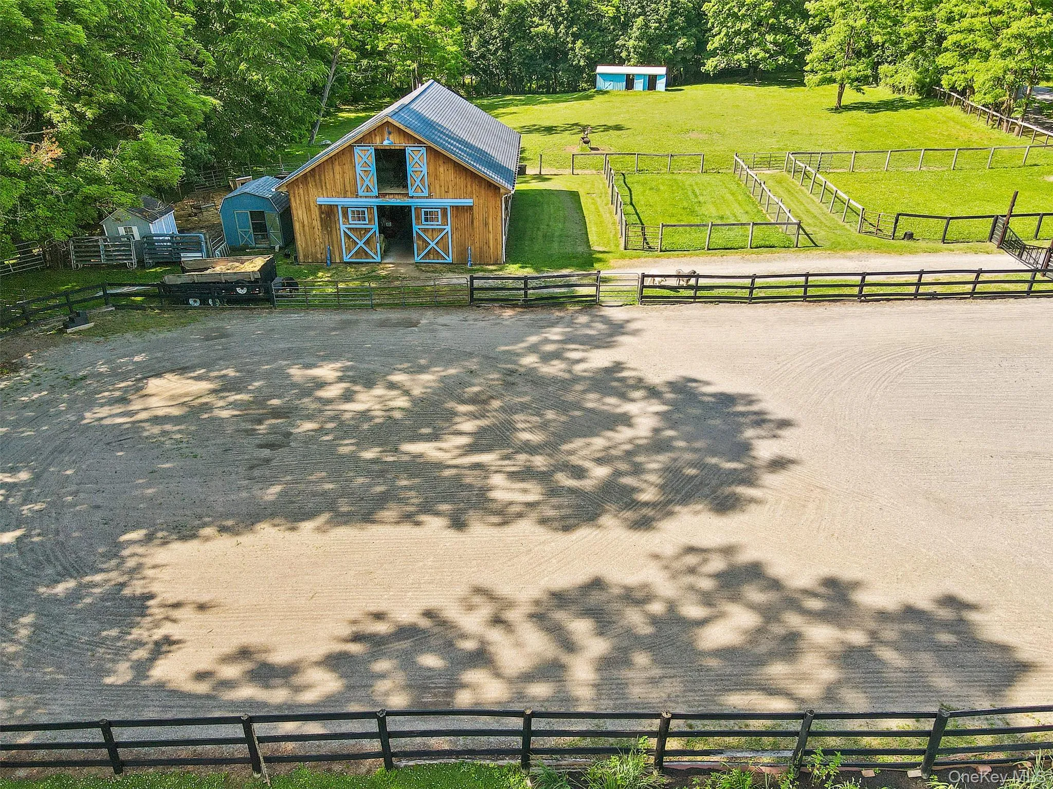 View of Barn with riding ring and paddocks. View of Barn with riding ring and paddocks.