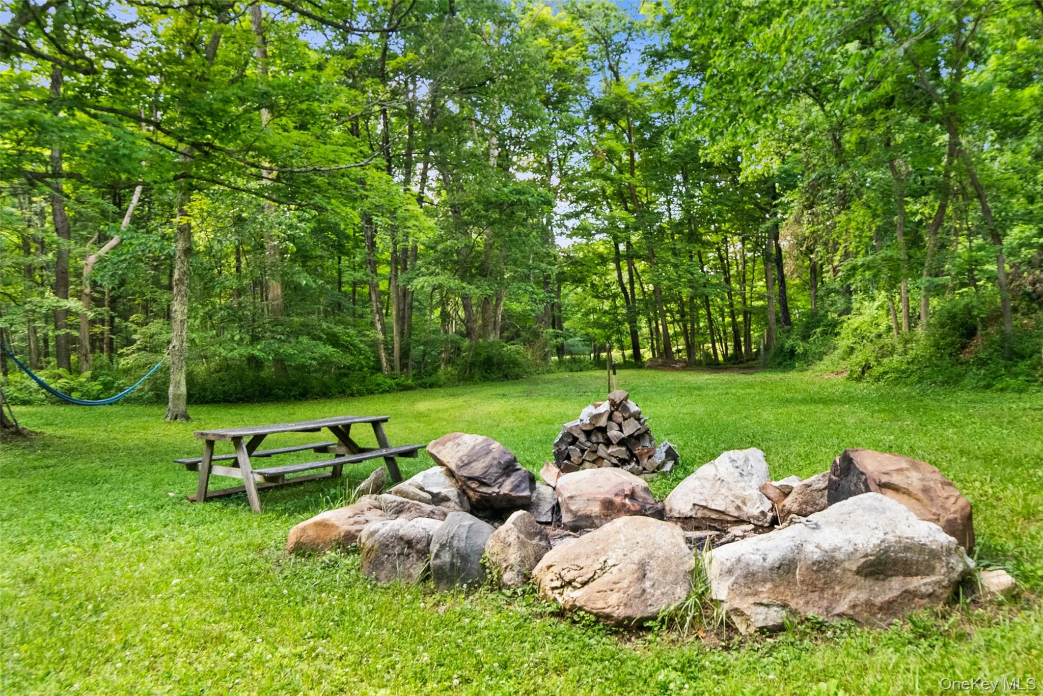 Another view of the fire pit with hammock! Another view of the fire pit with hammock!