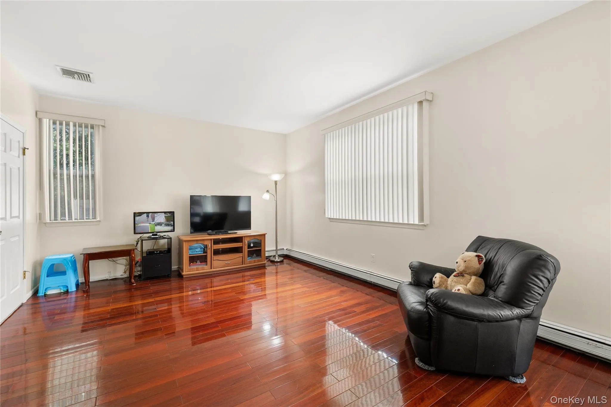 Family room with beautiful wood floors overlooking Eik Family room with beautiful wood floors overlooking Eik