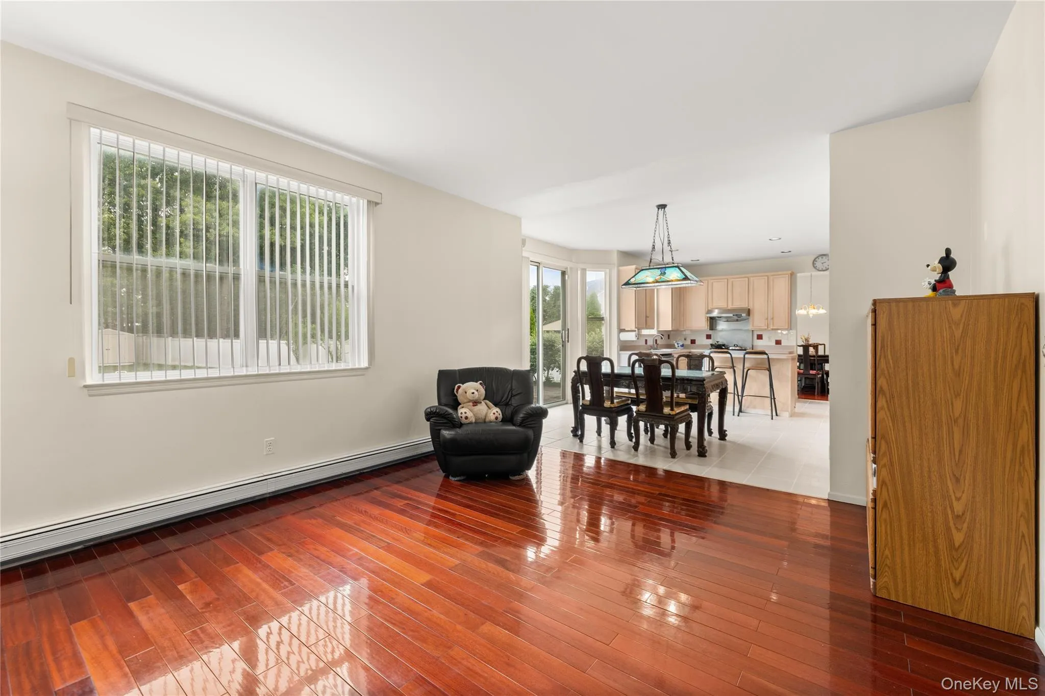 Family room with beautiful wood floors overlooking Eik Family room with beautiful wood floors overlooking Eik