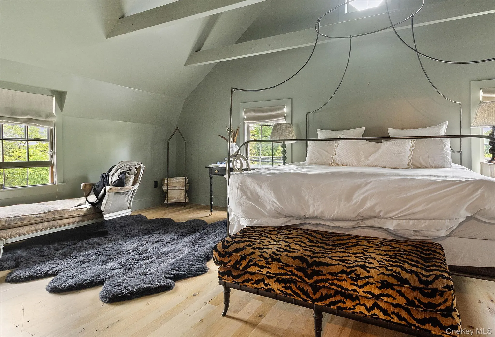 Bedroom with wood finished floors and baseboards Bedroom with wood finished floors and baseboards