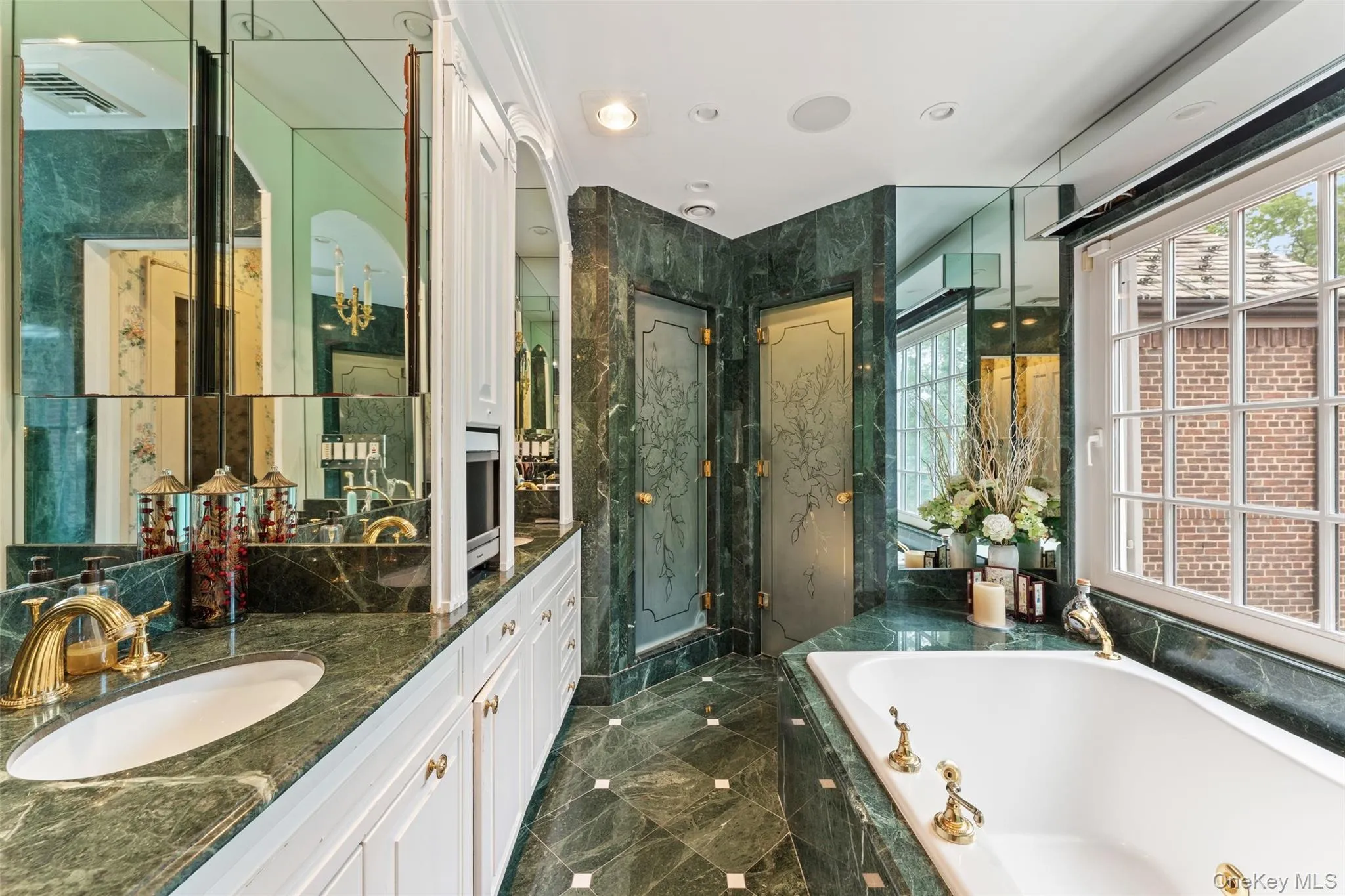 Primary bathroom with 2 vanities, jacuzi tub, stall shower and seperate water closet and radiant heated floors Primary bathroom with 2 vanities, jacuzi tub, stall shower and seperate water closet and radiant heated floors