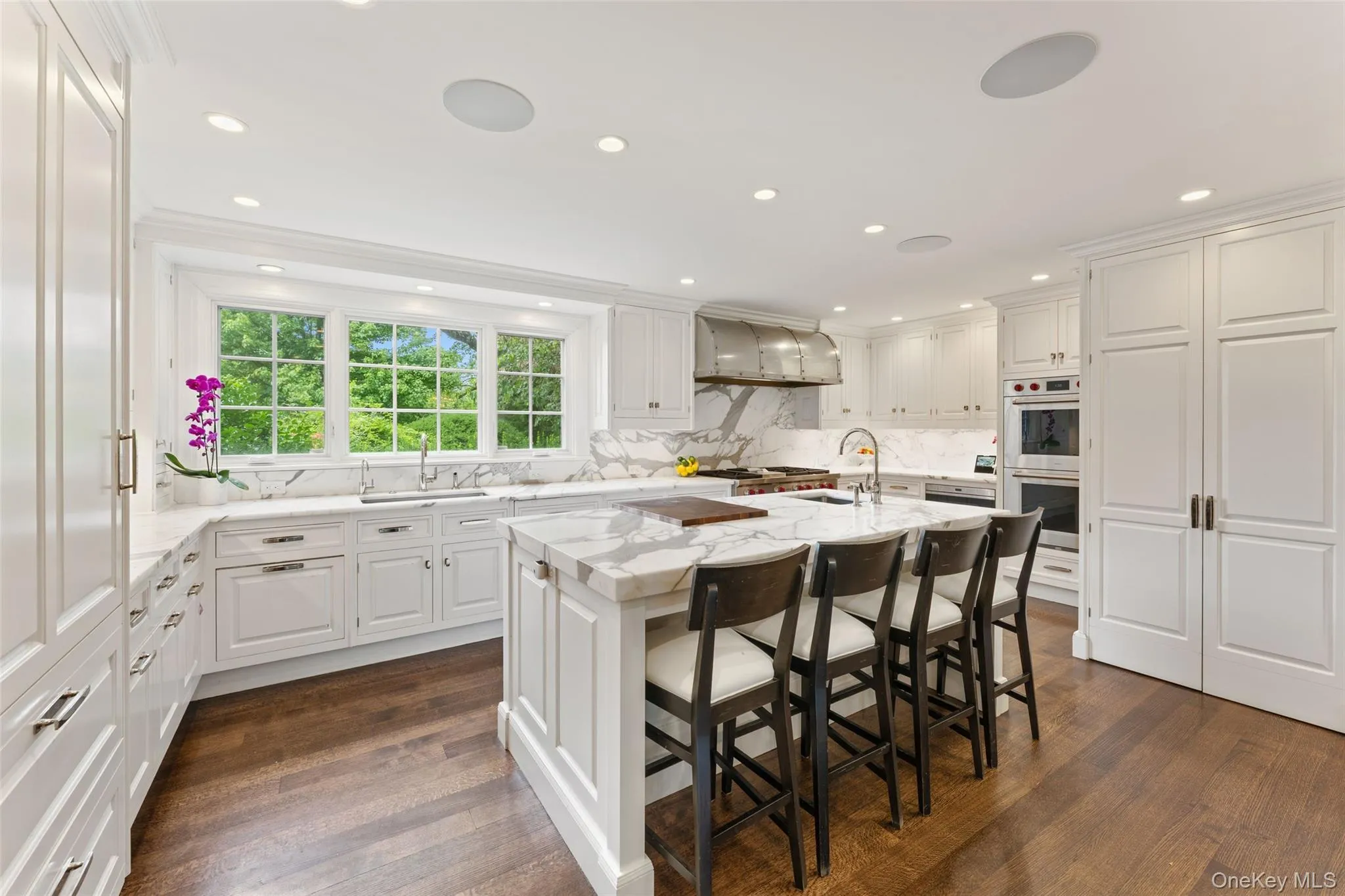 Kitchen center island with carrera marble and prep sink Kitchen center island with carrera marble and prep sink