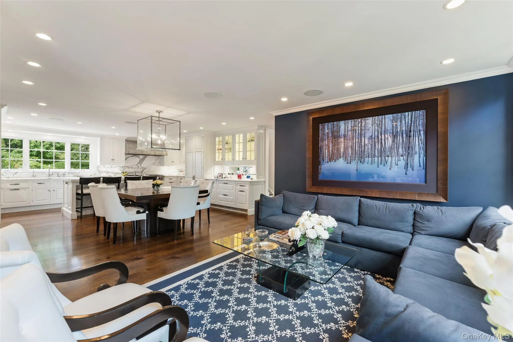 Family room with wrap around windows overlooking gardens Family room with wrap around windows overlooking gardens