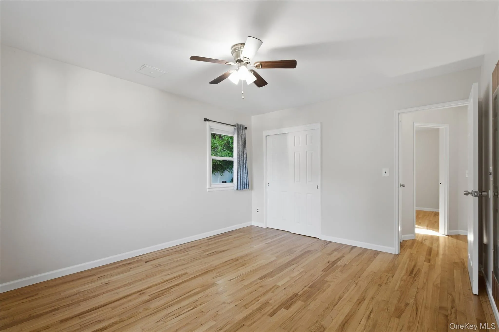 Light-colored wood-finish flooring extends throughout this interior space Light-colored wood-finish flooring extends throughout this interior space