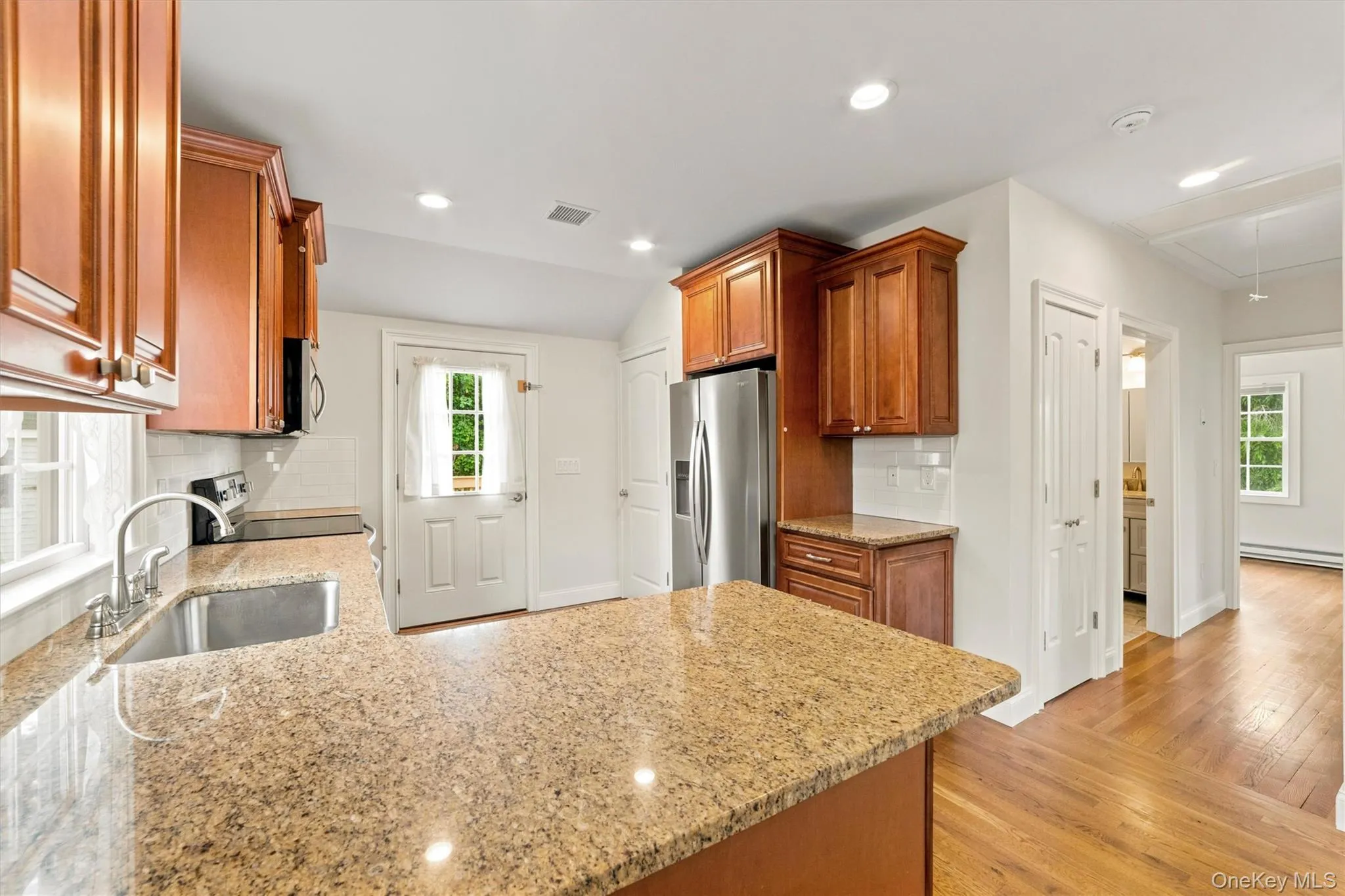 Renovated Kitchen with SS Appliances, New Cabinets, New Counters & Door to Deck Renovated Kitchen with SS Appliances, New Cabinets, New Counters & Door to Deck