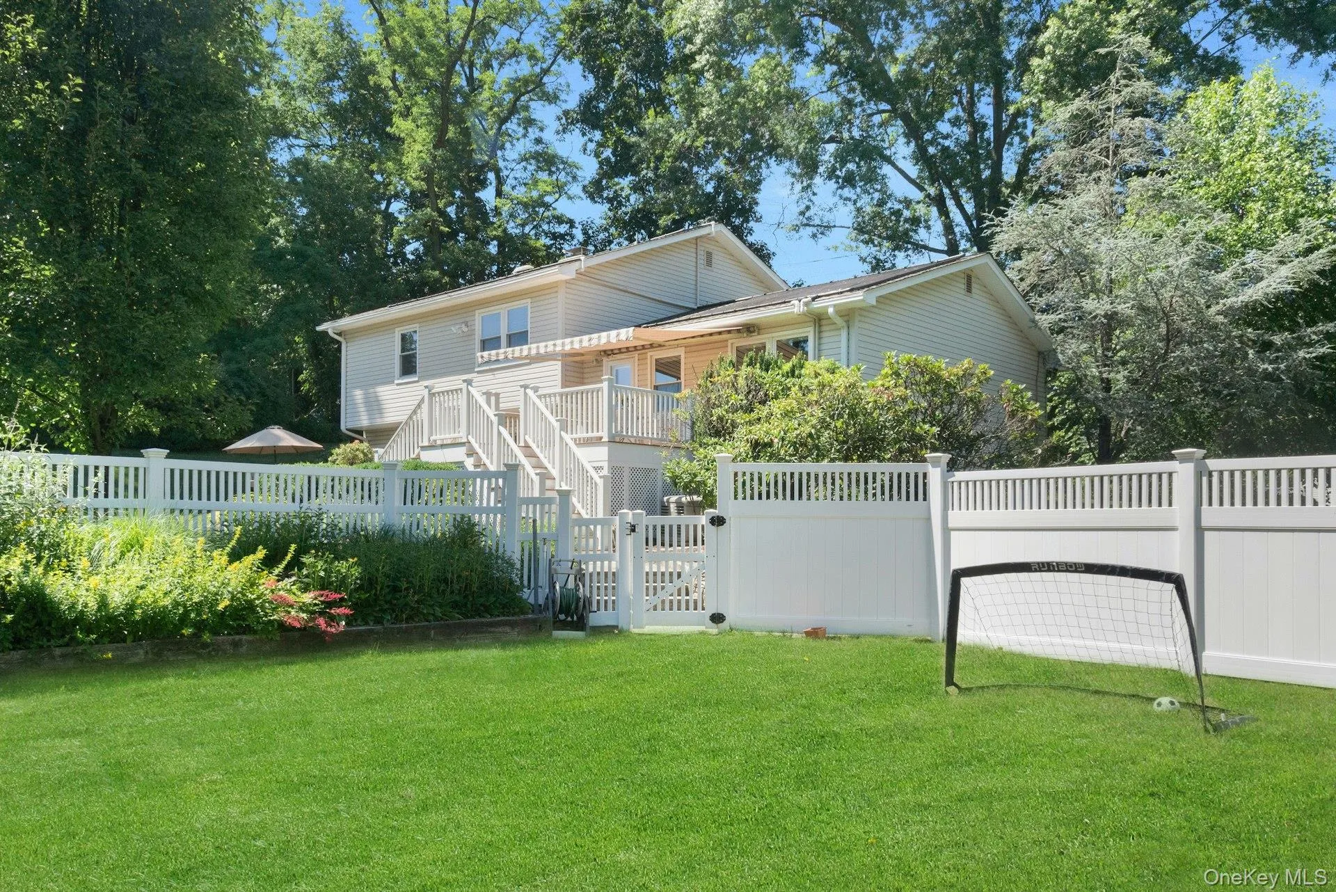 Looking from the fenced play yard towards the house. Looking from the fenced play yard towards the house.