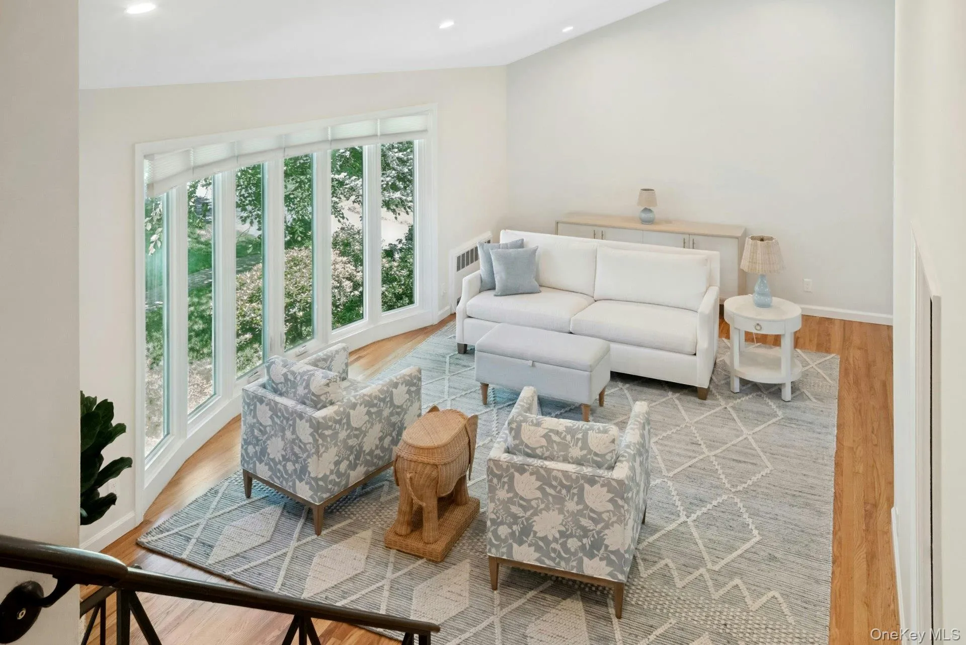 Looking down from the upper level landing at spacious bright LR and bay window area. Looking down from the upper level landing at spacious bright LR and bay window area.