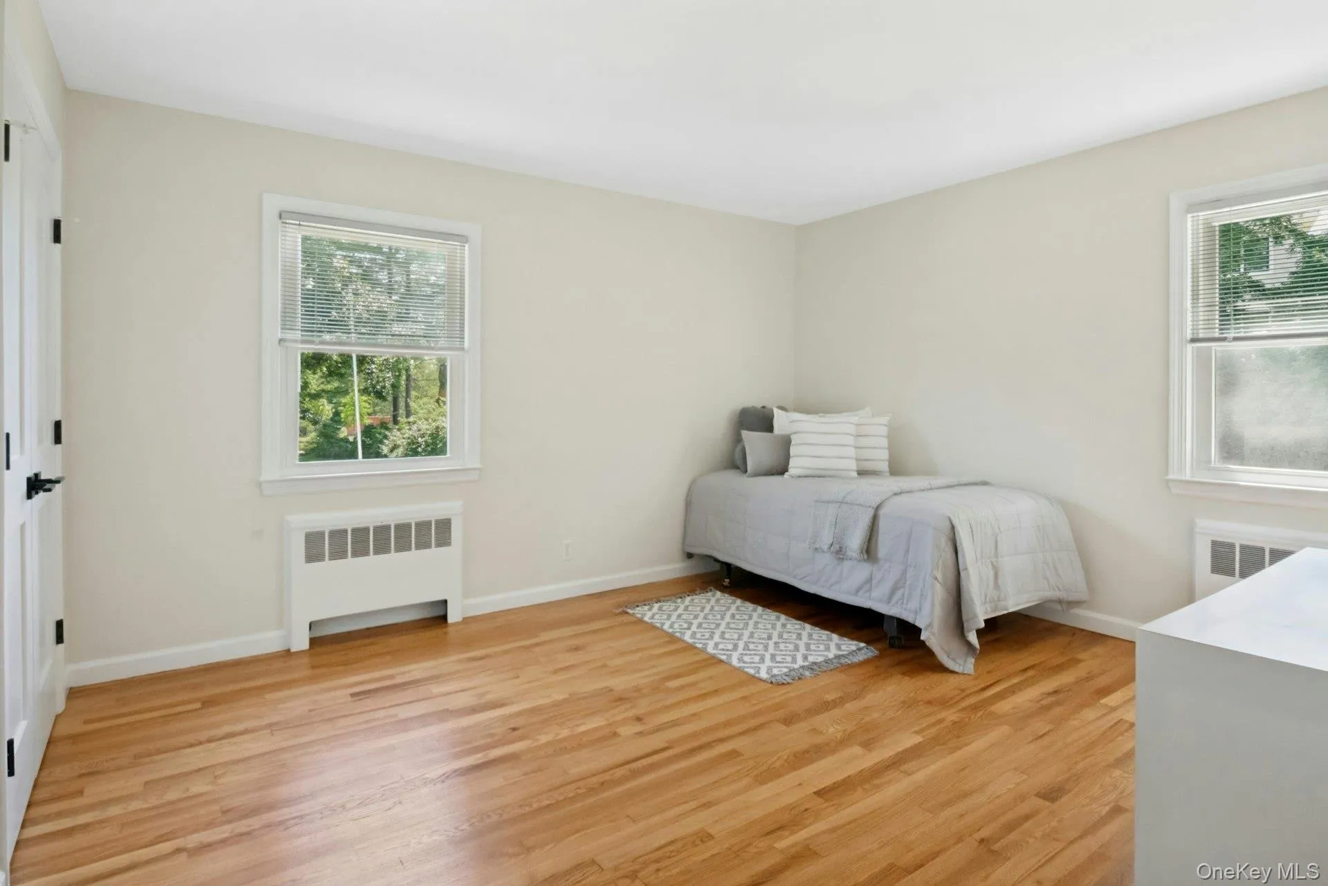 Bedroom 3 enjoys double exposures and newly refinished floors. Bedroom 3 enjoys double exposures and newly refinished floors.
